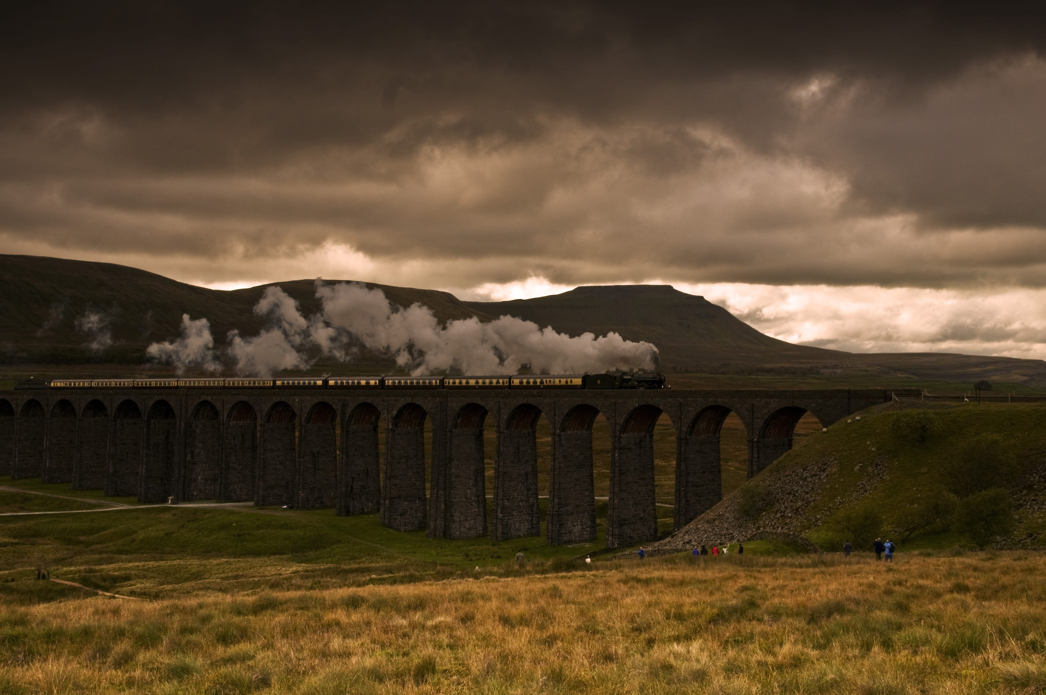 sky, arch bridge, light, grass, history, outdoors, architecture, environment, clouds, mountain, sunset, view, daylight, travel destinations, bridge - man made structure, HD Wallpaper