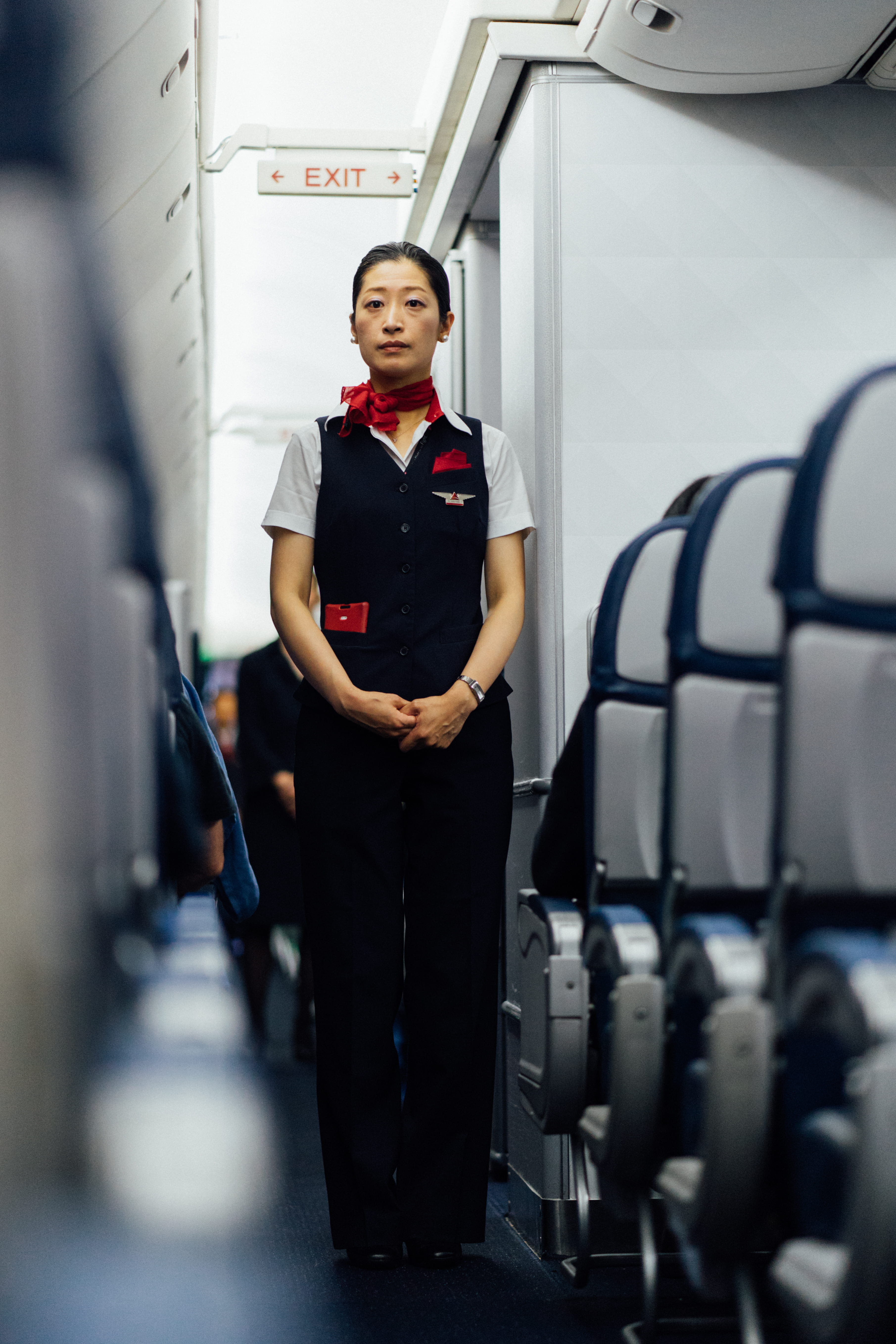 flight attendant, standing, near, clothing, black, plane, occupation, full length, safety, uniform, inside, portrait, stewardess, safe, women, deltum, aisle, Phone HD Wallpaper