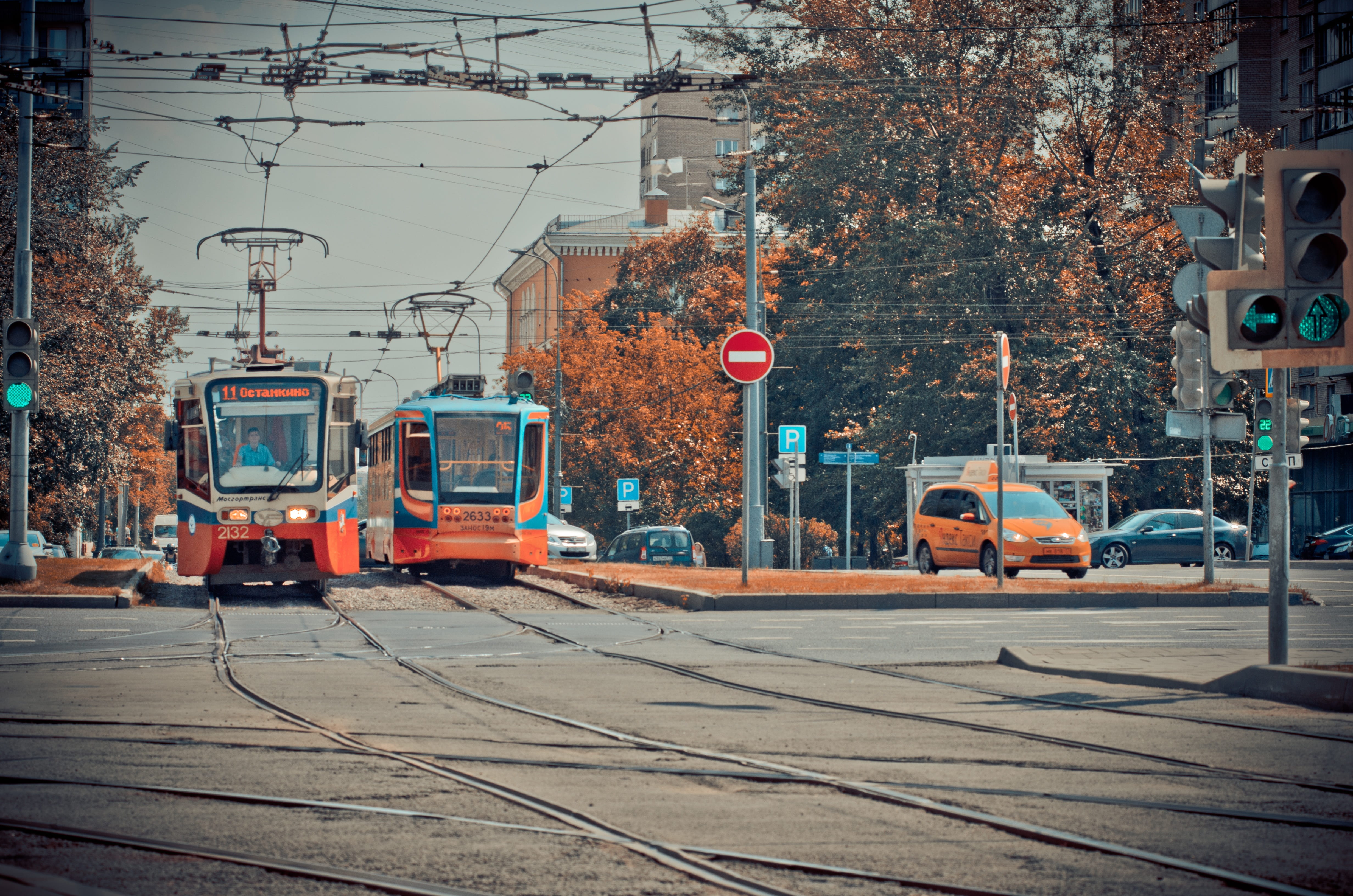 power supply, public transportation, land vehicle, motor vehicle, tram, city street, building exterior, city, car, railroad track, incidental people, cable, HD Wallpaper