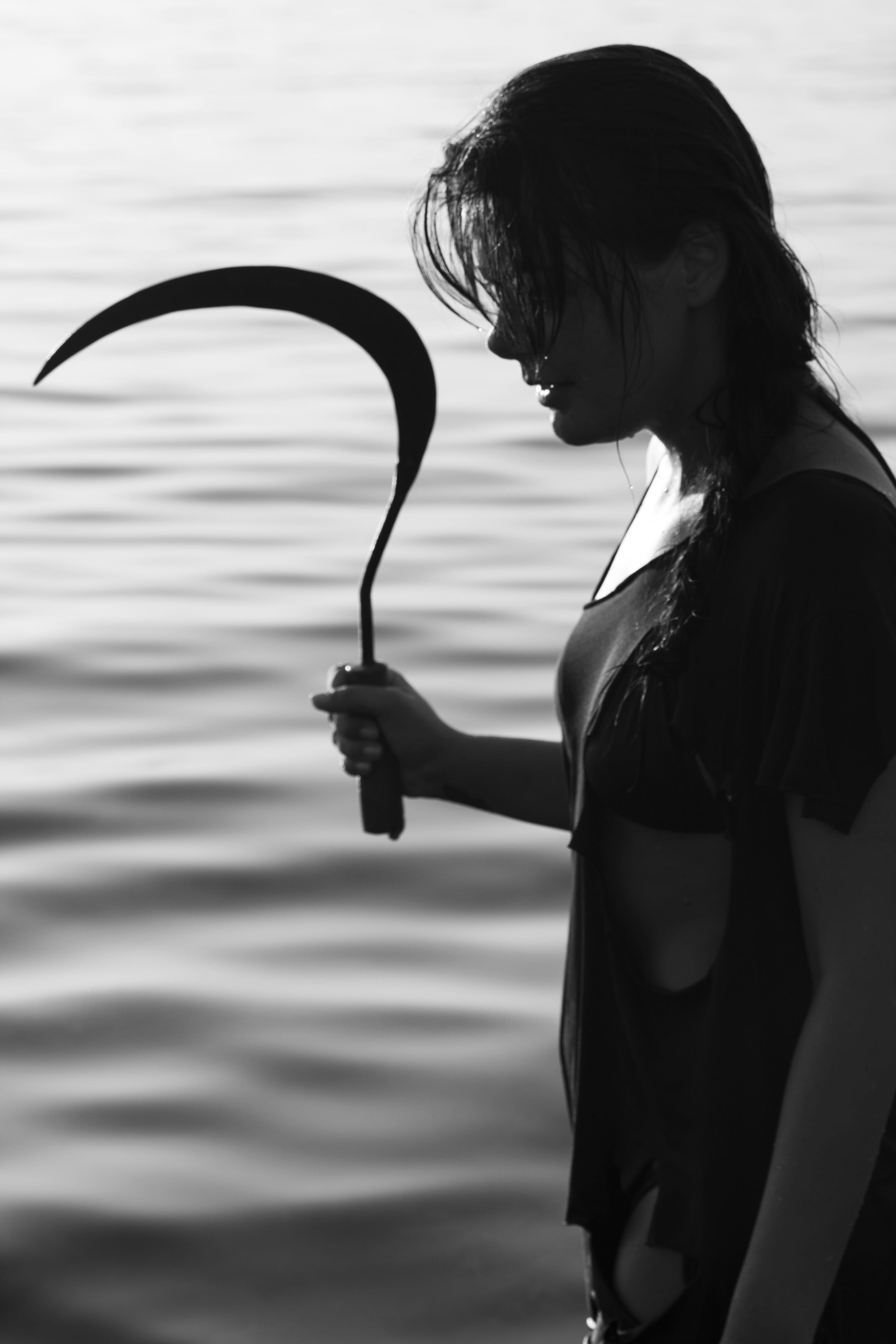focus on foreground, water, day, people, beautiful, contact, side view, WomenS, women, marine, fashion, deep, sickle, 4K, Fiction, holding, one woman only, Phone HD Wallpaper