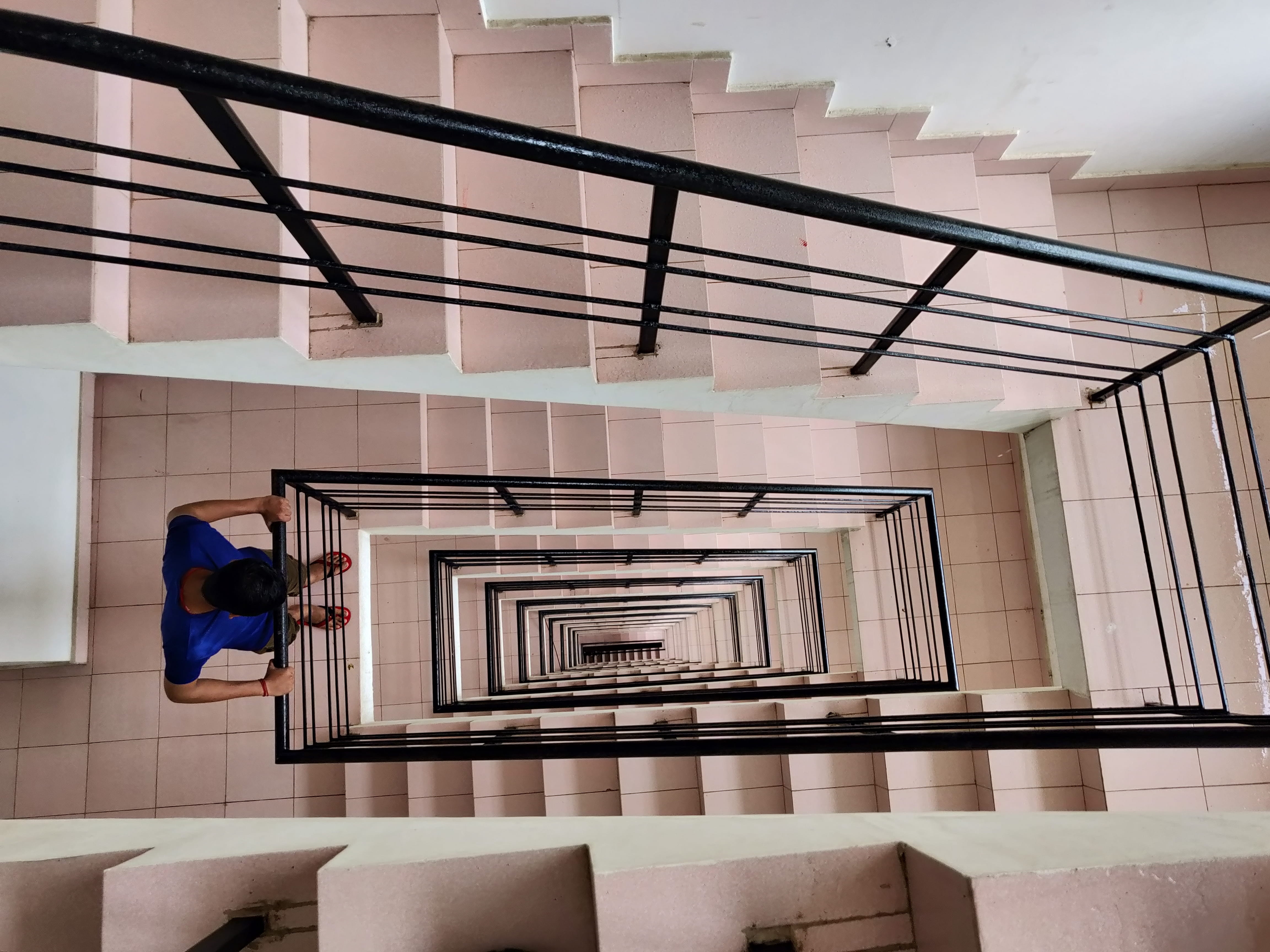 downwards, day, step, looking, built structure, pattern, perspective, 4K, steps and staircases, hanging, contemporary, clothing, design, building, man, HD Wallpaper