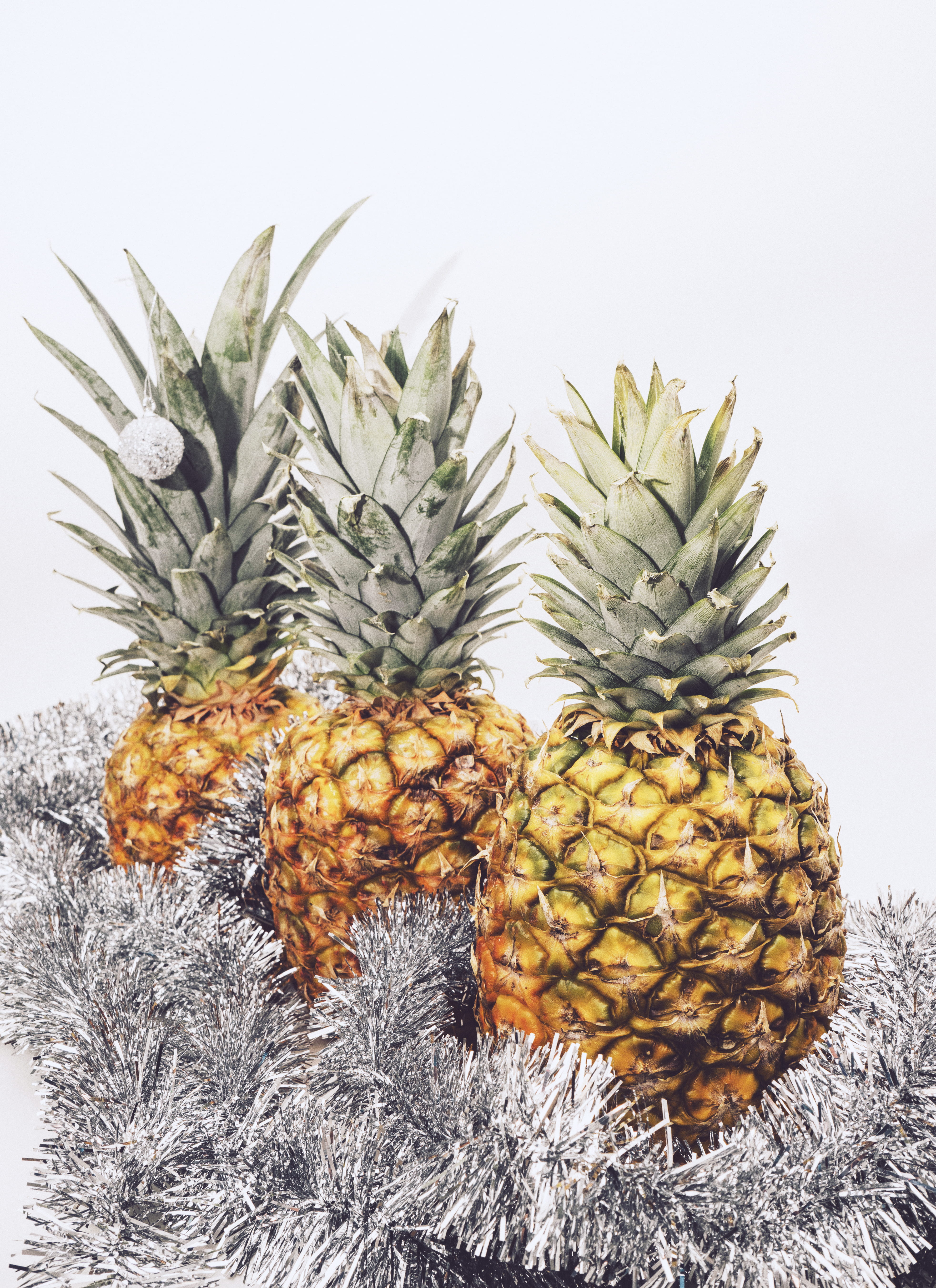 tinsel, food and drink, pineapple display, fruit, wellbeing, coniferous tree, plant, 5K, nature, studio shot, pineapple, white background, three, no people, Phone HD Wallpaper