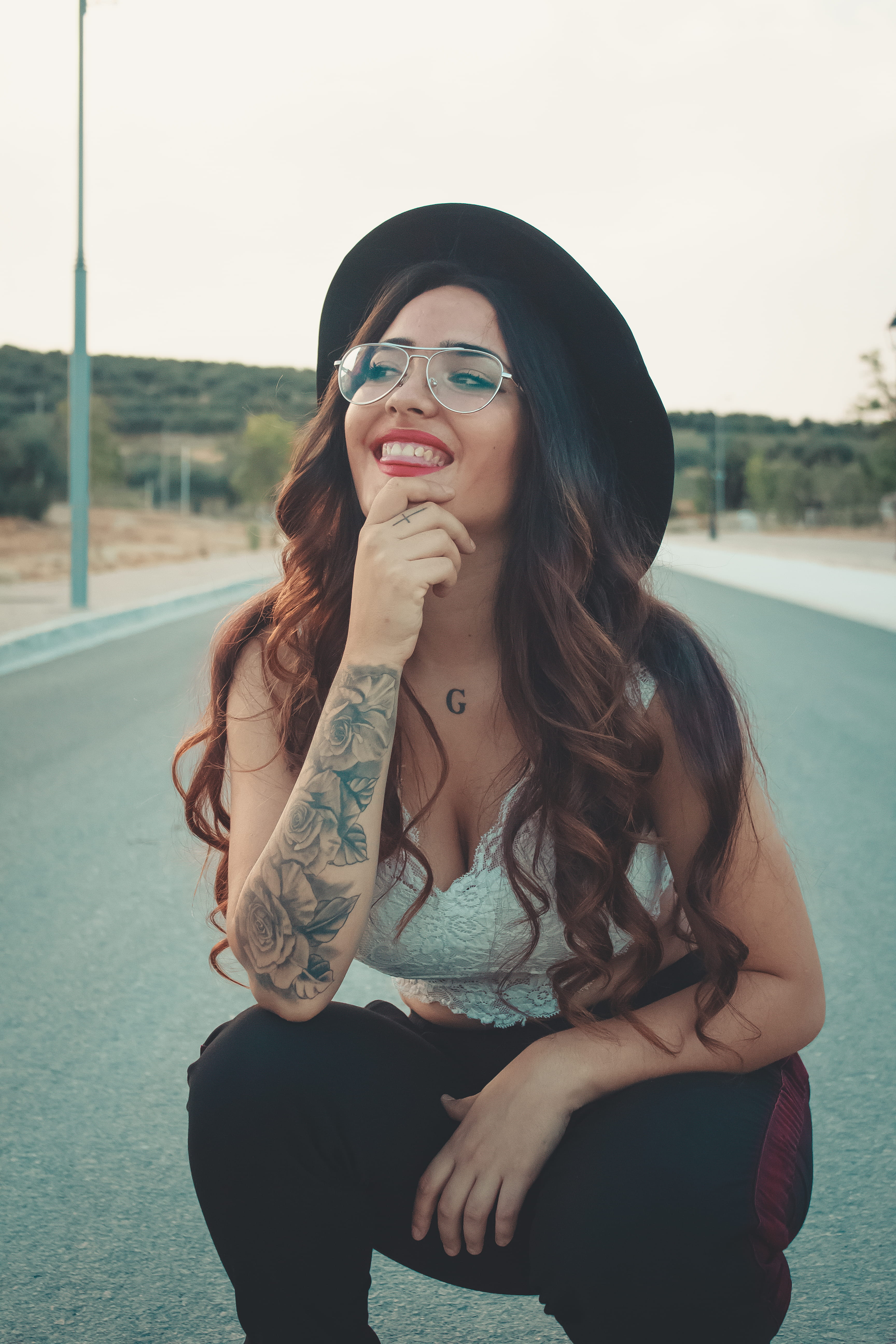 sitting, young adult, girl, beauty, montefrío, one person, beautiful woman, long hair, 5K, real people, casual clothing, hair, hat, outdoors, female, spain, Phone HD Wallpaper