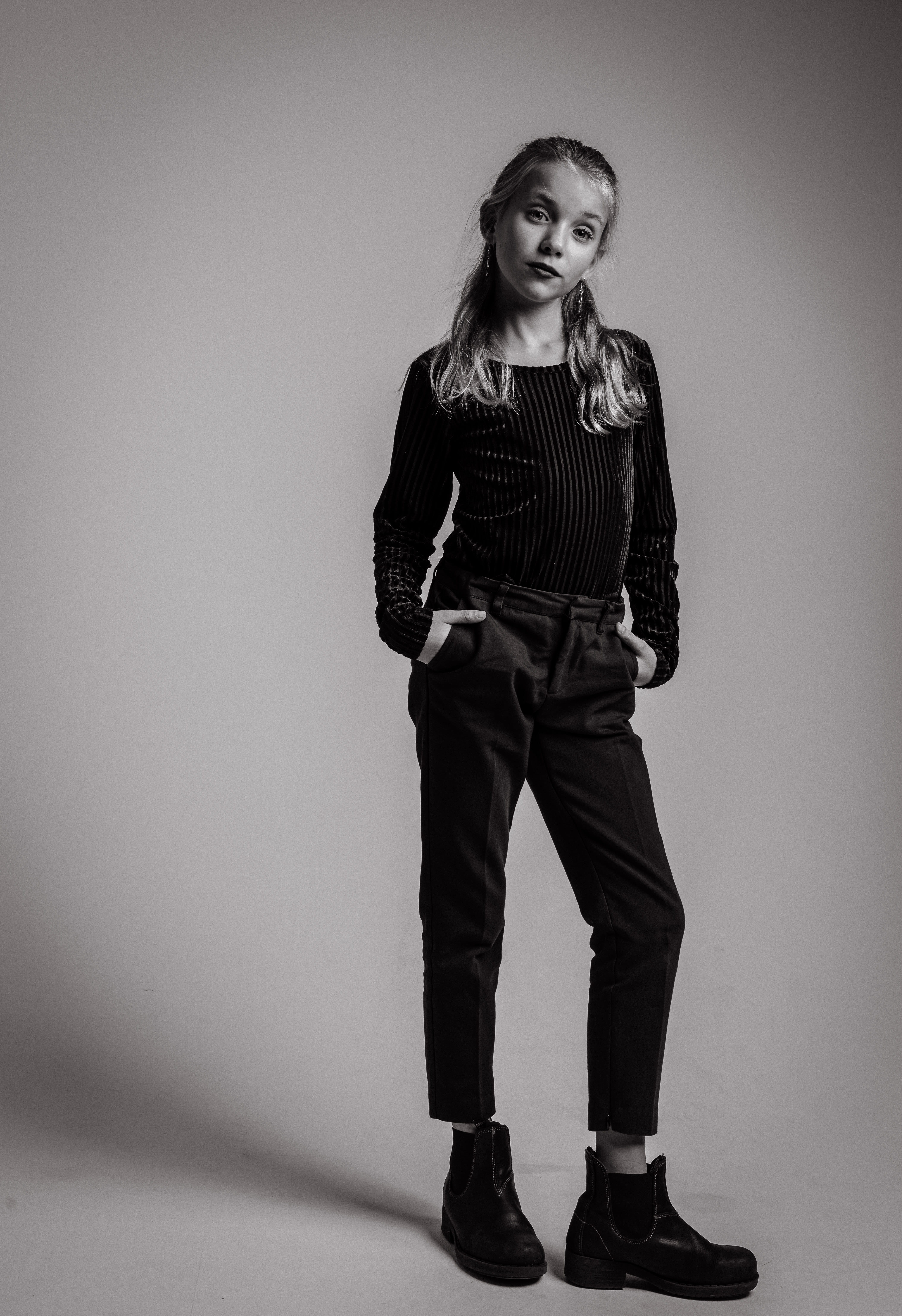 person, studio, long sleeves, studio shot, girl, front view, grayscale, pants, adolescent, model, 5K, jeans, hair, attitude, portrait, full length, long, Phone HD Wallpaper