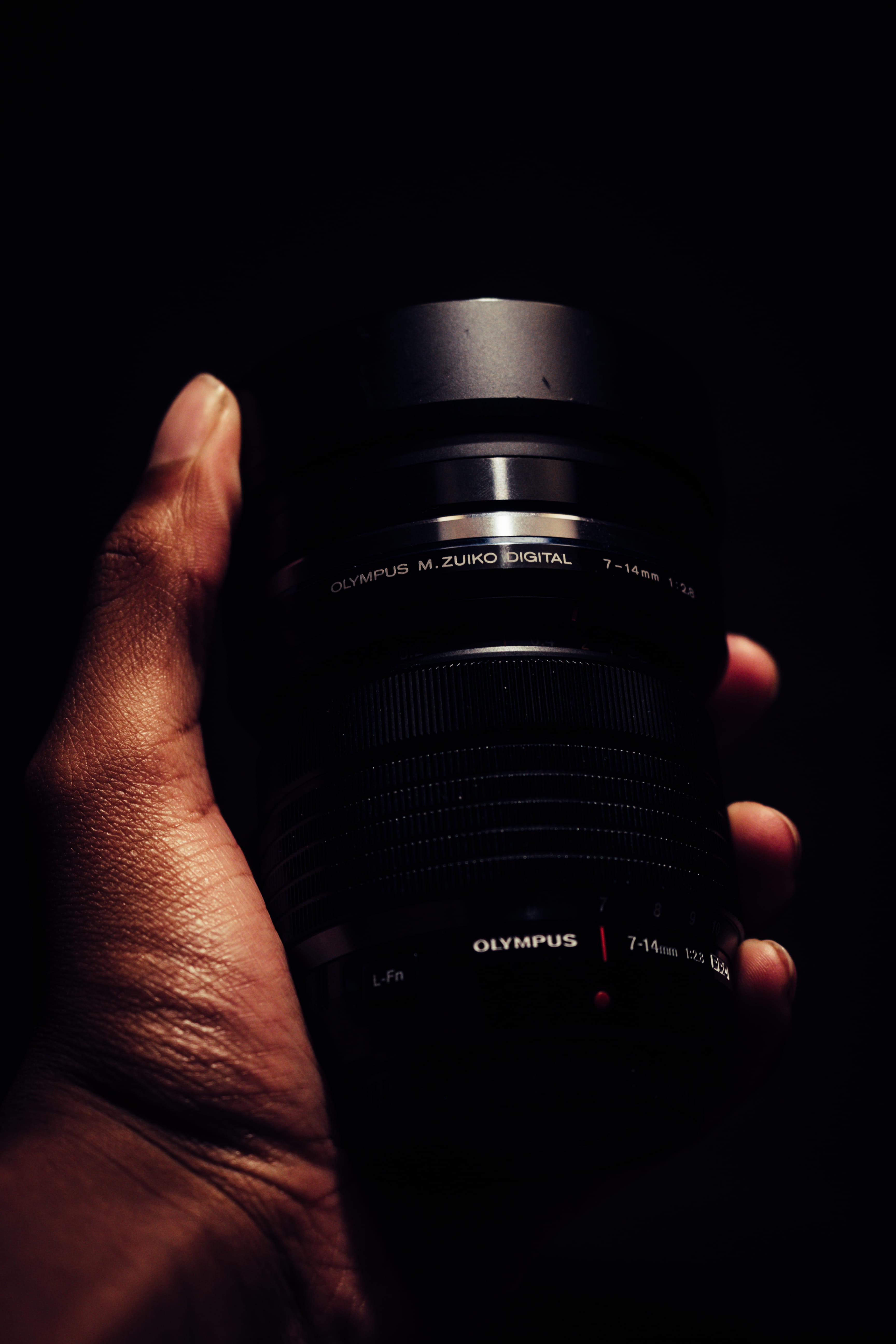 black background, human finger, equipment, lens, black, indoors, micro four thirds, photographer, slr camera, body part, camera - photographic equipment, Phone HD Wallpaper