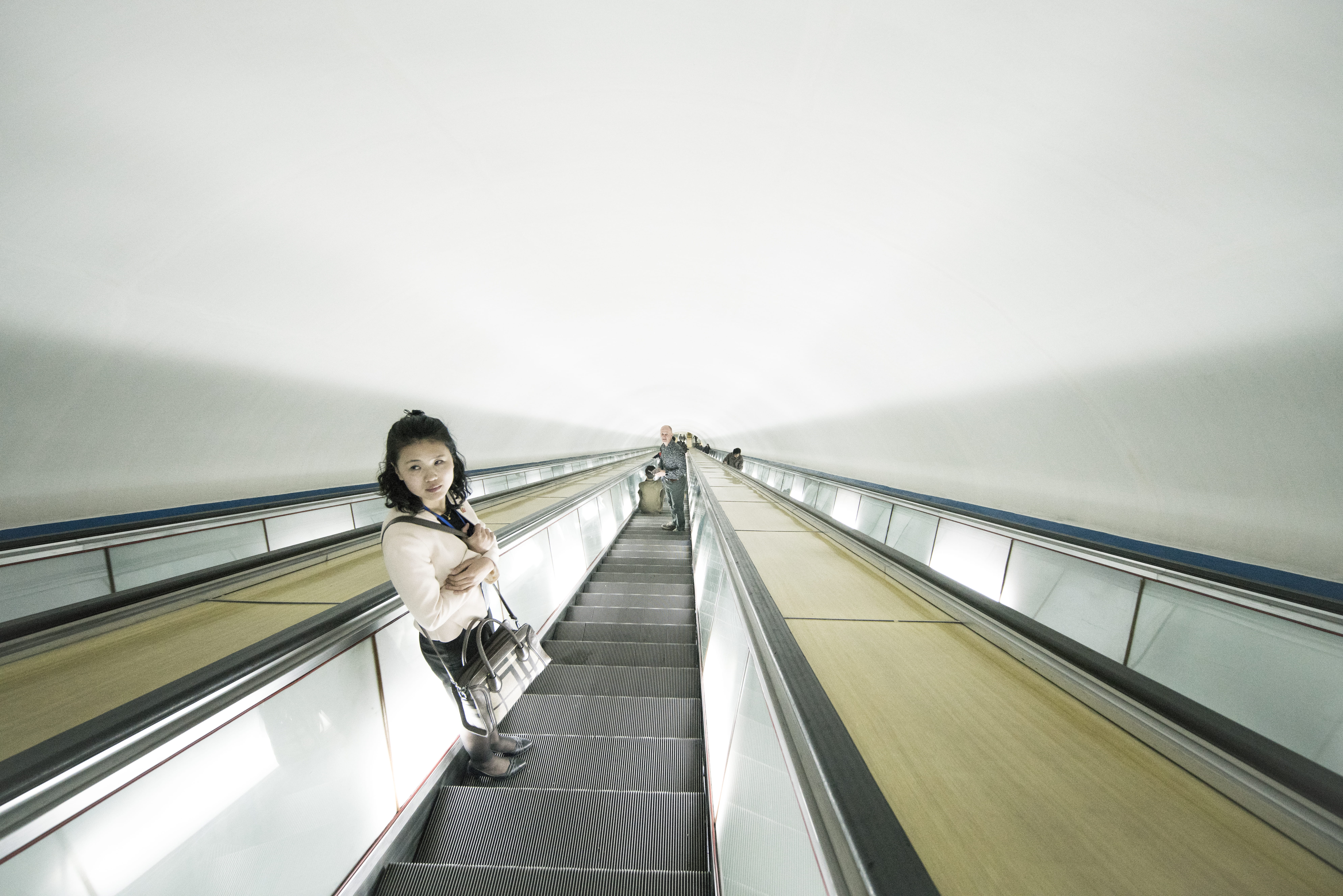 direction, human, dprk, clothing, 8K, metro, down, sky, escalator, going down, day, standing, transportation, railing, corridor, portrait, balcony, woman, HD Wallpaper
