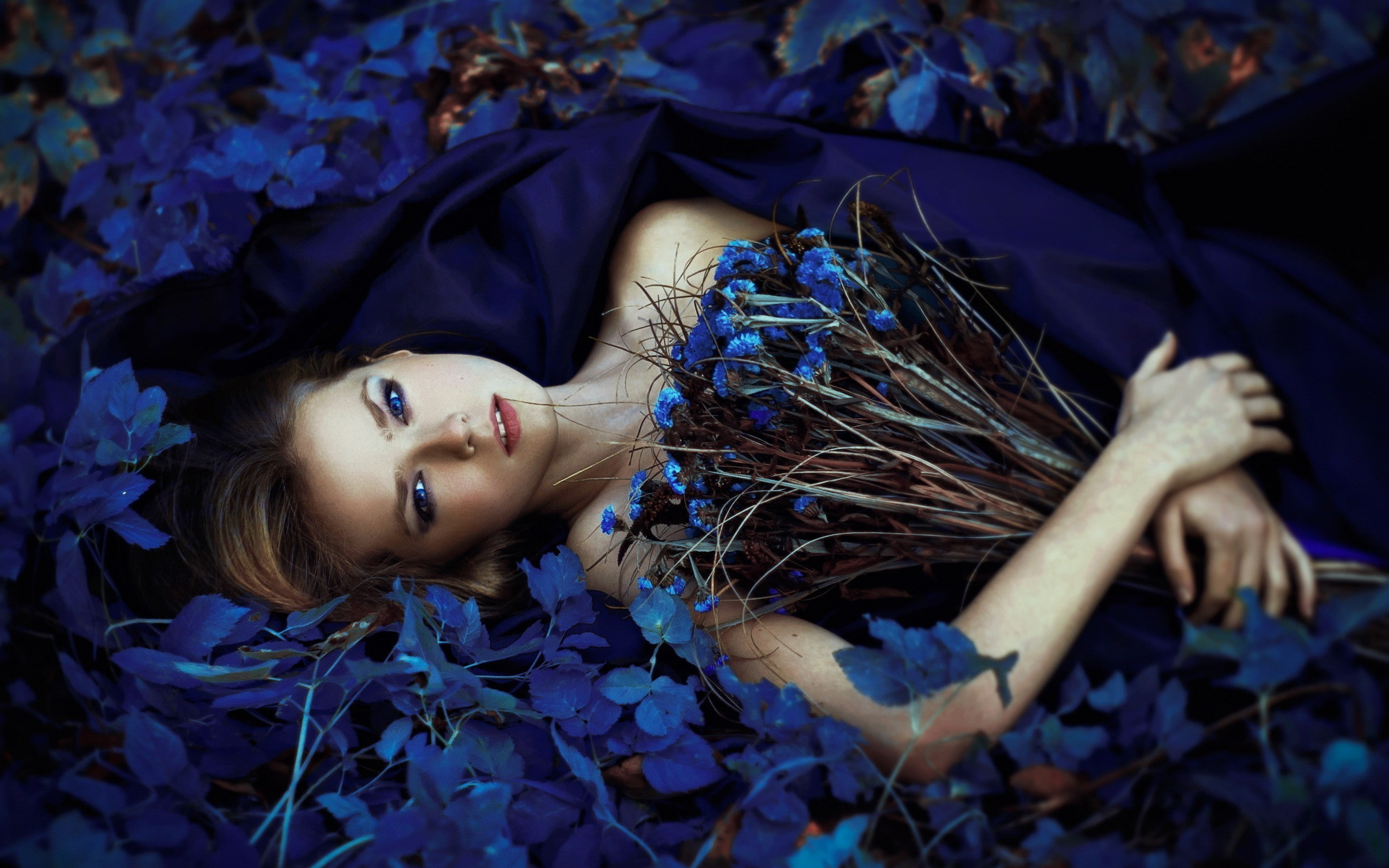 leaves, lying on back, blue flowers, bouquets, women outdoors, model, flowers, fantasy girl, women, looking at viewer, blue eyes, bare shoulders, 2K, HD Wallpaper