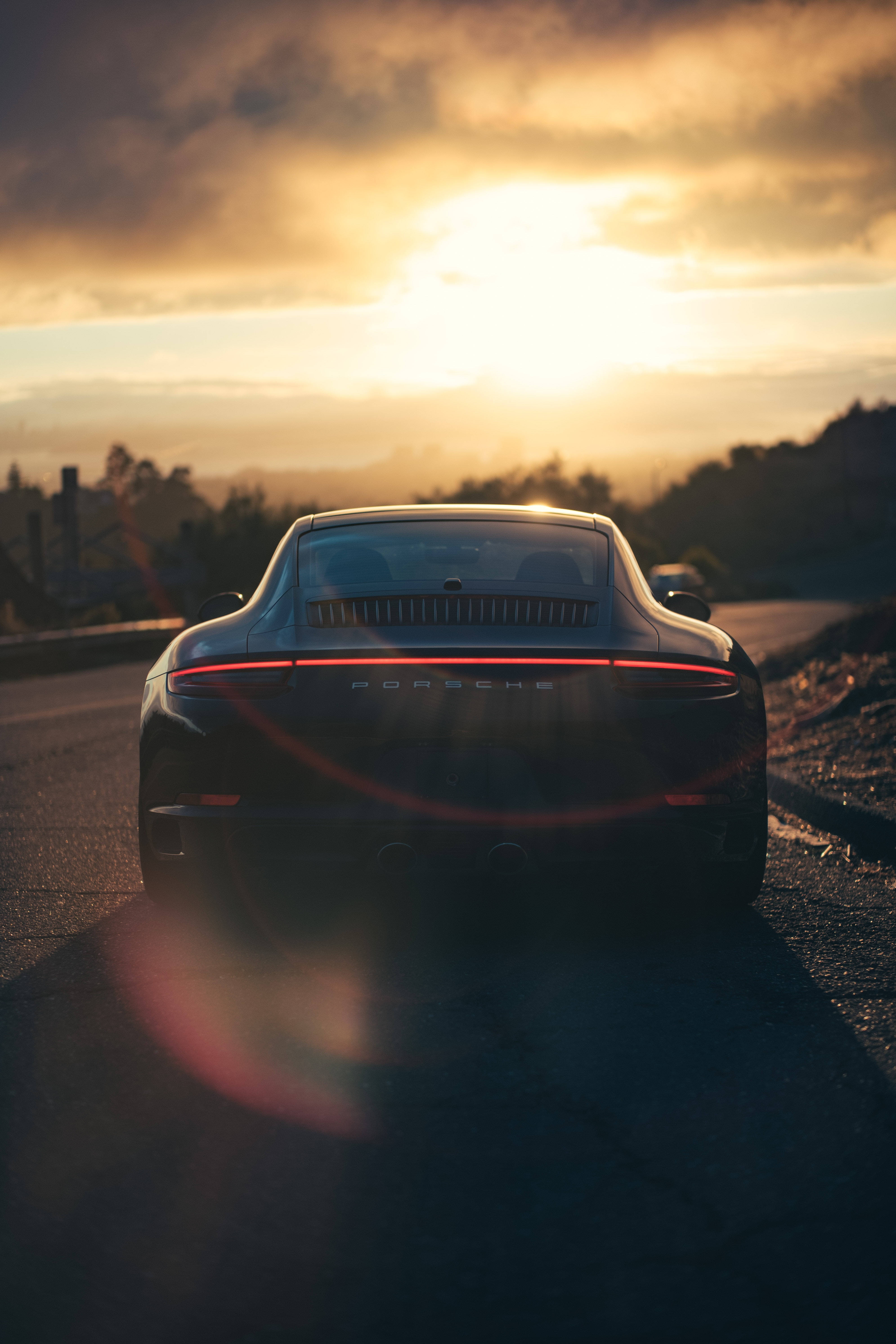 5K, sunlight, rear view, movement, black, sports car, porsche, Phone HD Wallpaper