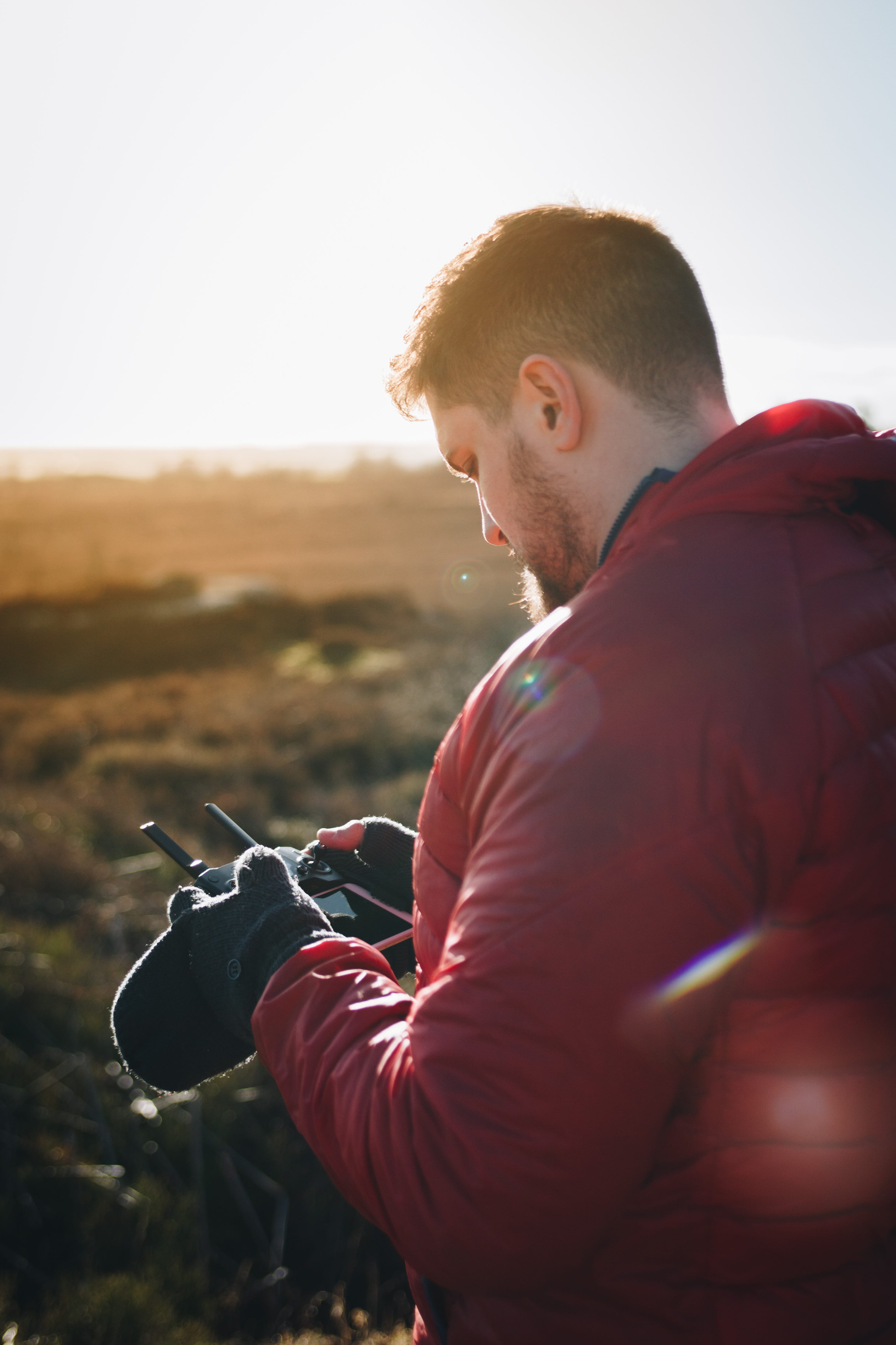 man, controls, sky, red, young men, nature, looking, young adult, 4K, adventure, remote, lifestyles, side view, jacket, casual clothing, sunlight, one person, Phone HD Wallpaper