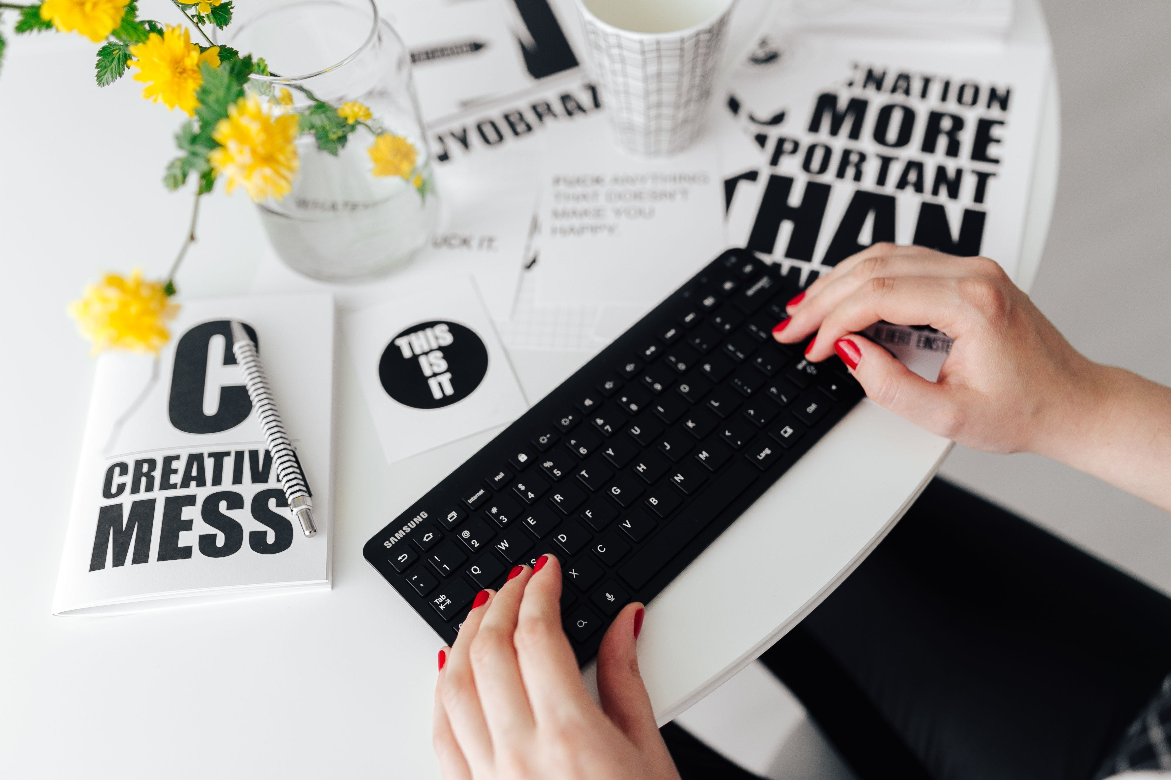 writing, hand, computer keyboard, human body part, text, table, female office, high angle view, remote, typing, workplace, communication, flower, minimalist, HD Wallpaper