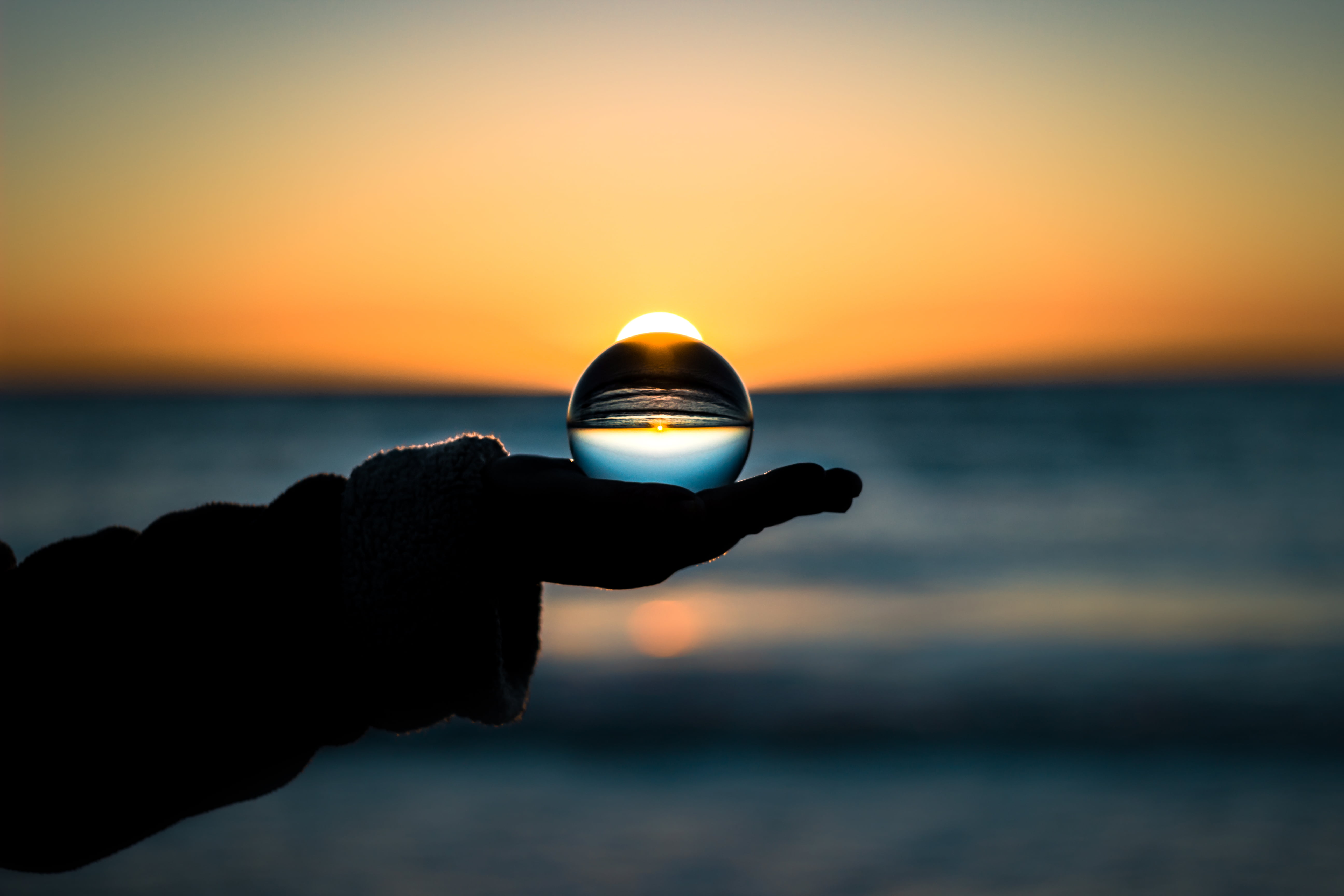 one person, 5K, sky, sphere, blue, ideas, focus on foreground, horizon, single Object, water, holding, land, light - Natural Phenomenon, symbol, concepts, HD Wallpaper