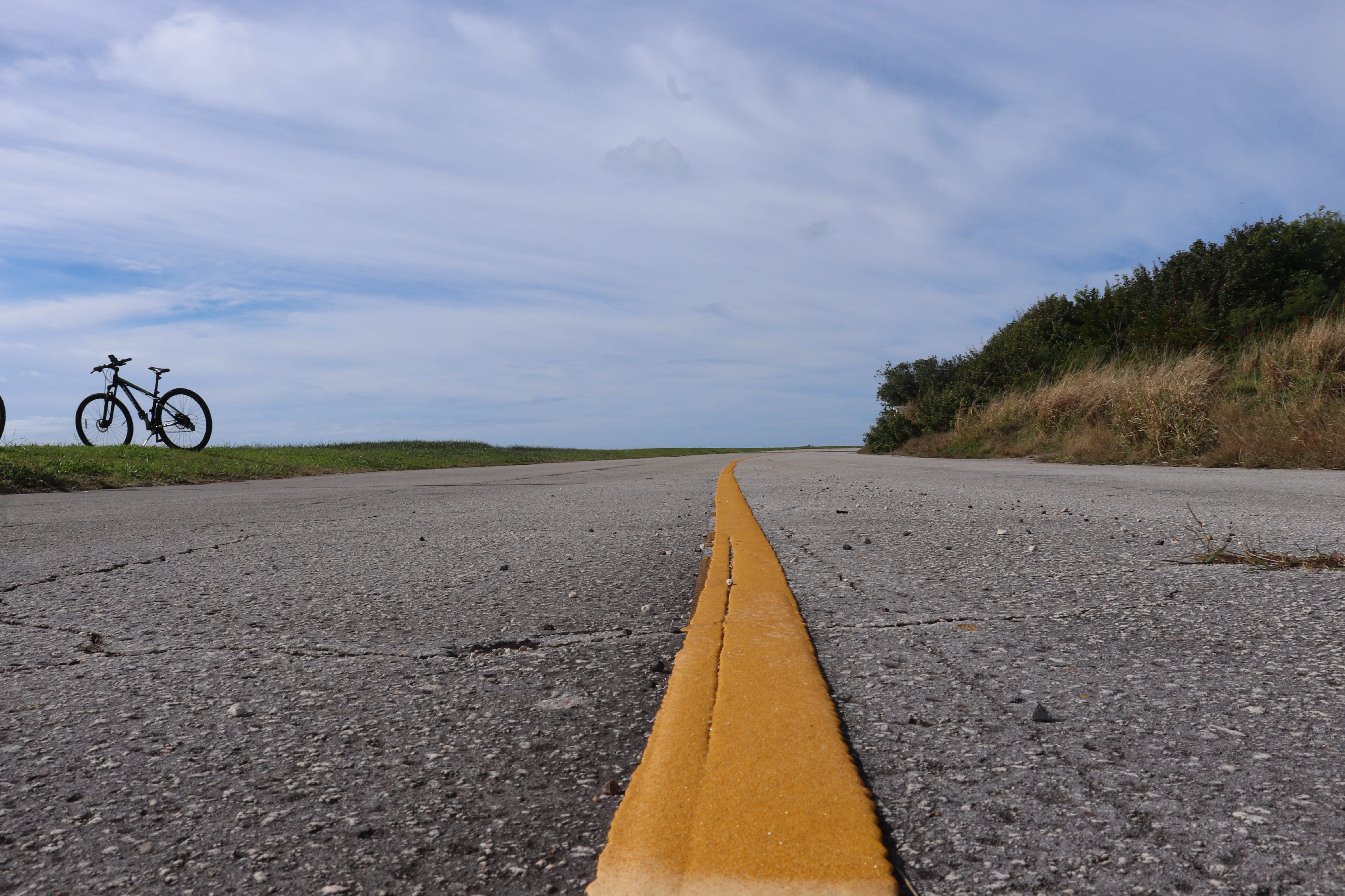 diminishing perspective, direction, sign, asphalt, wheel, gravel, way, nature, runway, airport, yellow, flagstone, road marking, day, cloud - sky, highway, HD Wallpaper