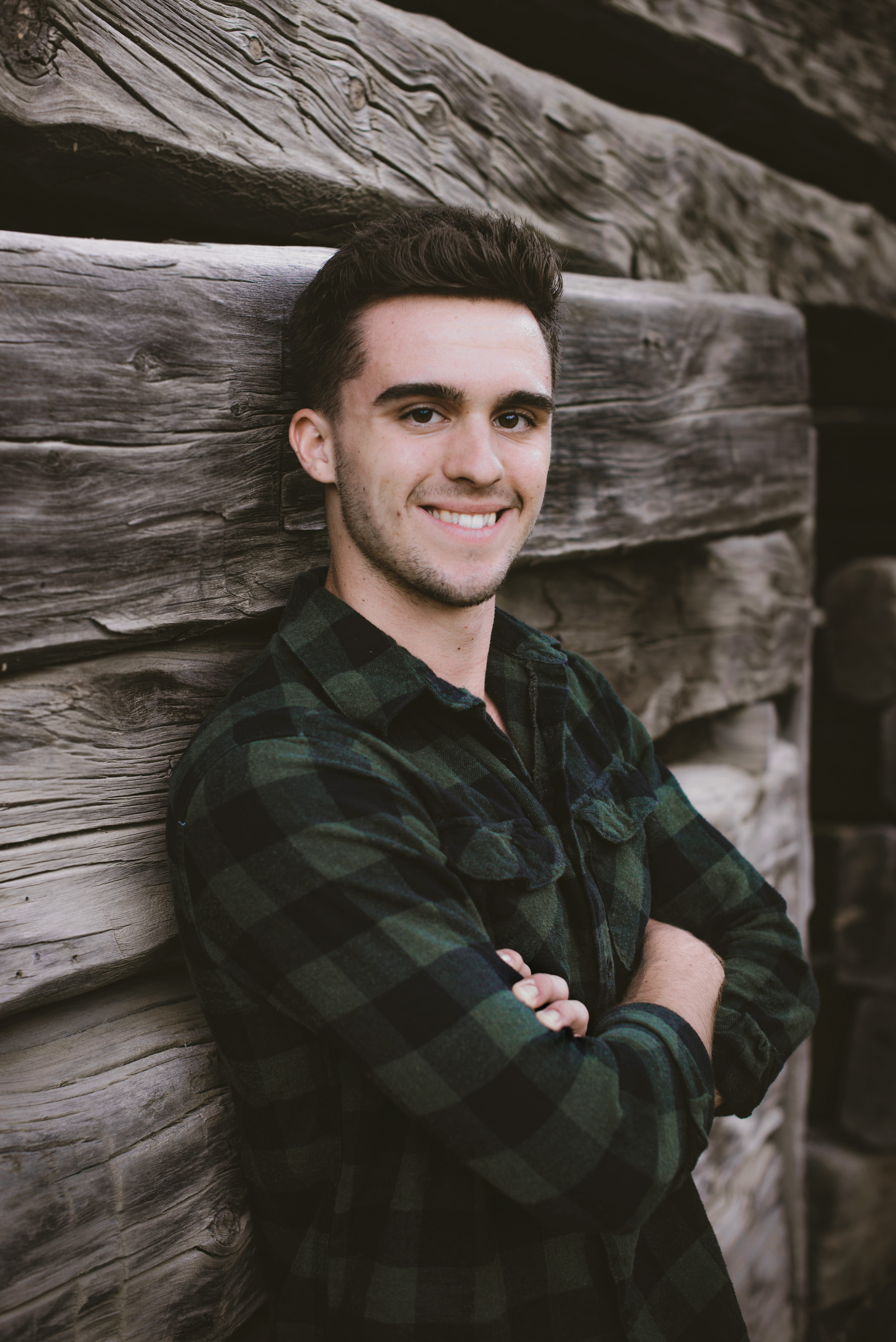 leisure activity, wall, wooden, male, wood, real people, males, men, backround, leaning, young, casual clothing, short hair, young adult, one person, man, Phone HD Wallpaper