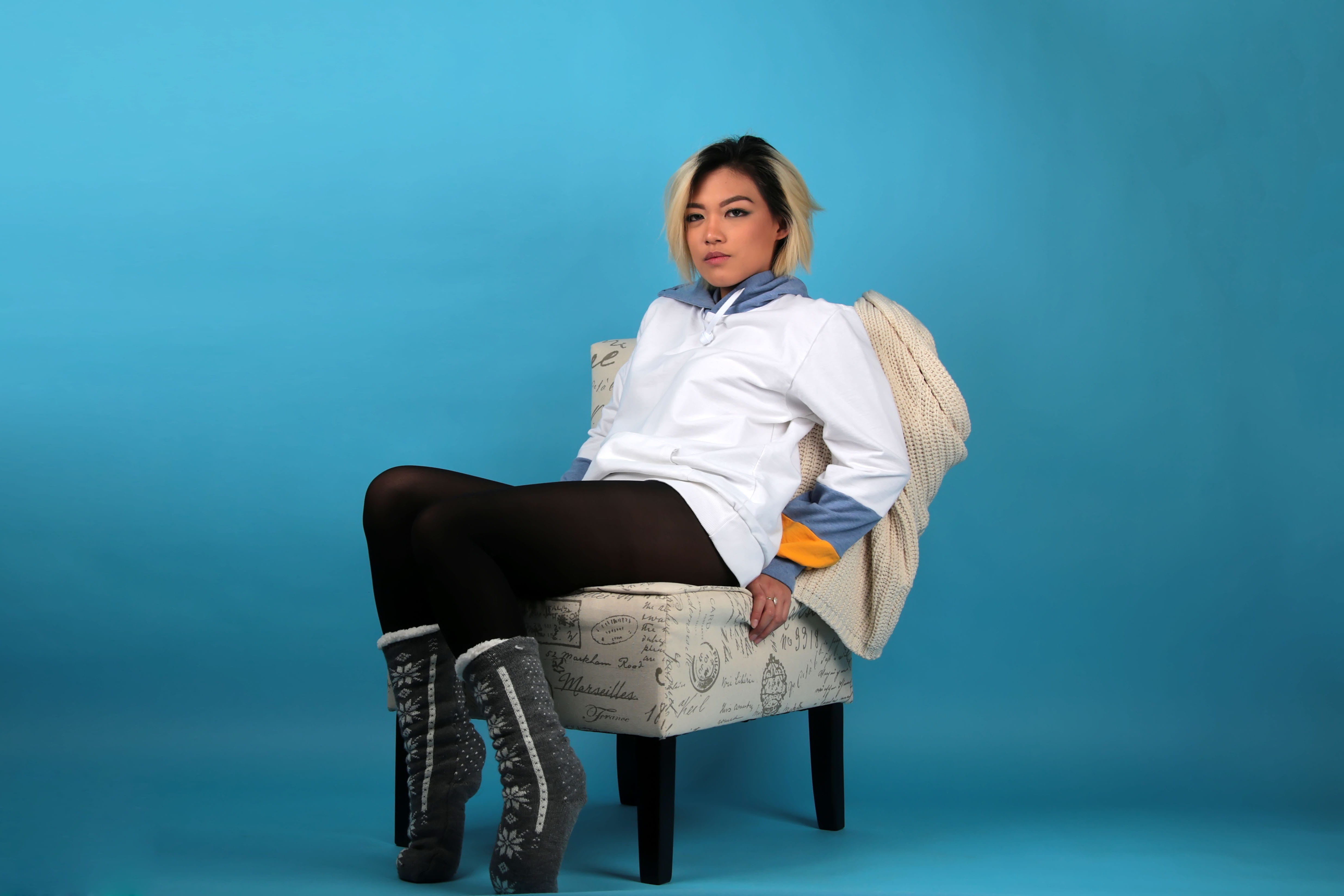 model, studio shot, hairstyle, clothing, blue, blue background, studio, looking, cute, woman, portrait, photoshoot, armless, chair, seat, lifestyles, pose, HD Wallpaper