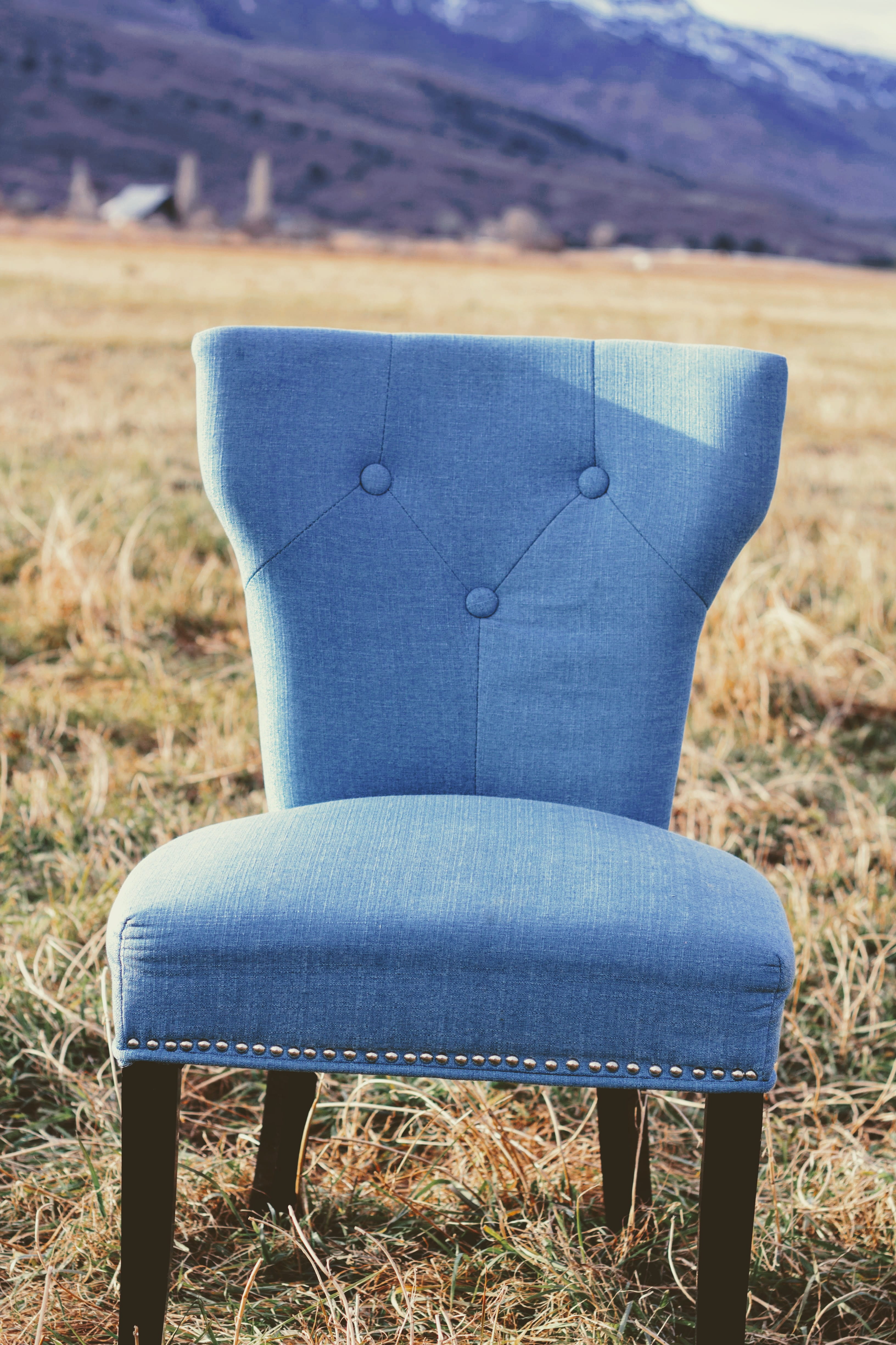 sitting, blue, environment, daytime, grass, armchair, relaxation, armless, tufted, chair, land, 4K, one person, leisure activity, padded, seat, focus on foreground, Phone HD Wallpaper