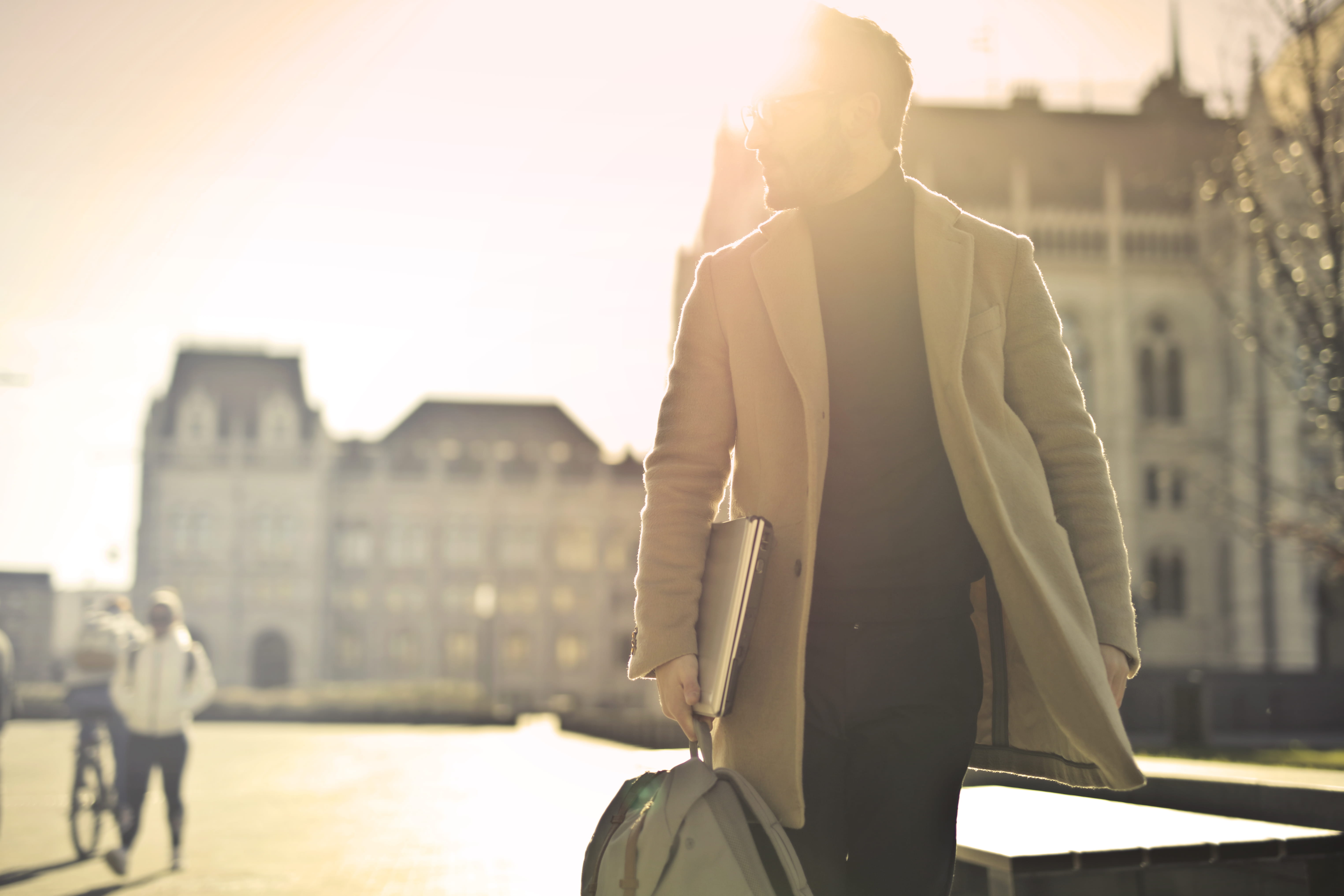 business, business man, nature, sunlight, backpack, technology, standing, guy, wearing, books, man, men, walking, one person, near, laptop, person, lens flare, HD Wallpaper