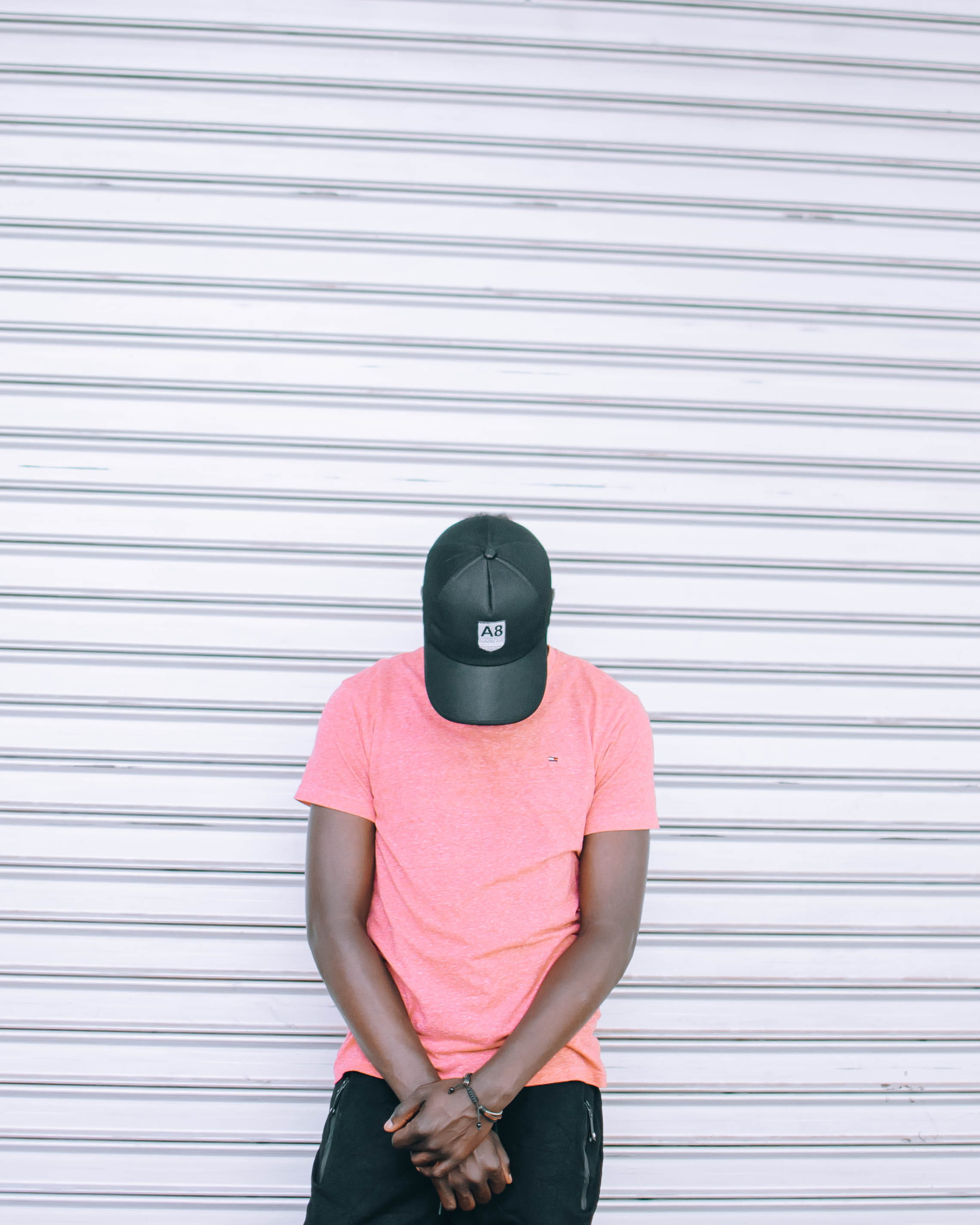 wall - building feature, unrecognizable person, t-shirt, real people, day, head, wall, pink, headwear, casual clothing, security, one person, wearing, standing, Phone HD Wallpaper
