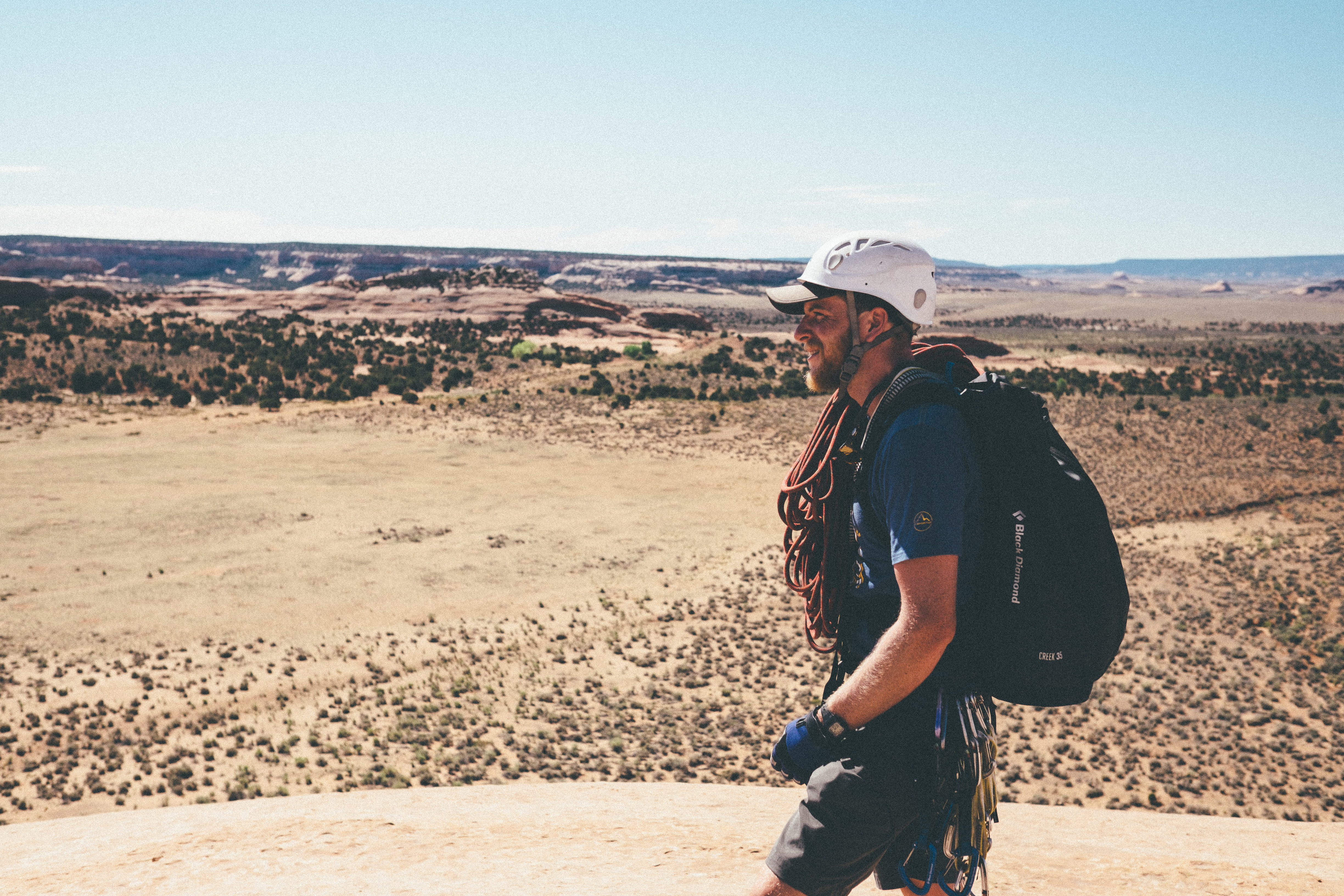 casual clothing, climber, gear, backpack, valley, white, nature, sunlight, standing, male, environment, sky, outdoors, landscape, land, hat, hiker, clothing, HD Wallpaper