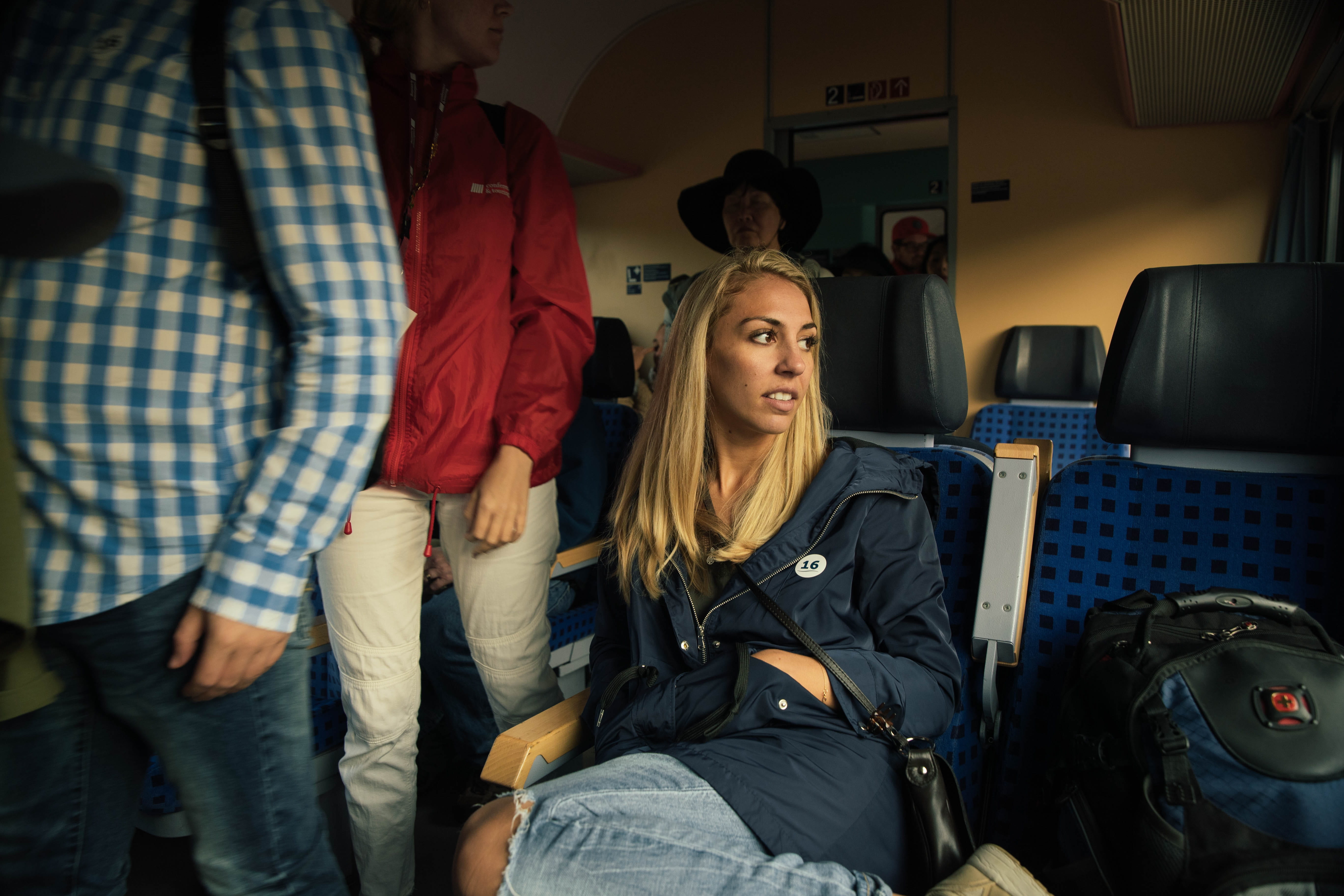 human, woman, blonde, apparel, real people, lifestyles, men, airplane seat, clothing, indoors, girl, vehicle interior, passenger, adult, person, helmet, HD Wallpaper