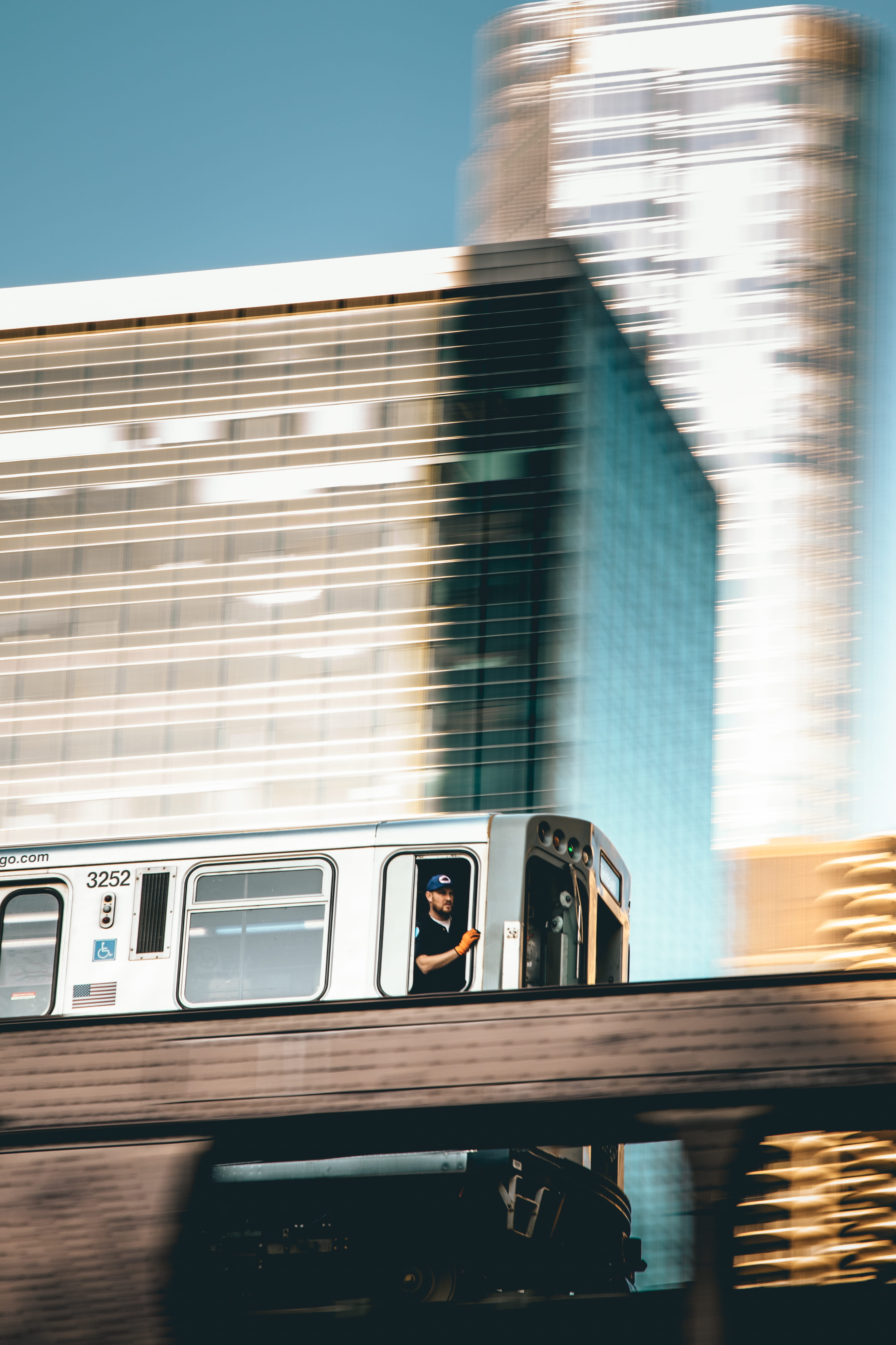 commuter, gray, no people, train - vehicle, architecture, city Life, motion, track, person, building exterior, rails, travel Locations, outdoors, city, Phone HD Wallpaper