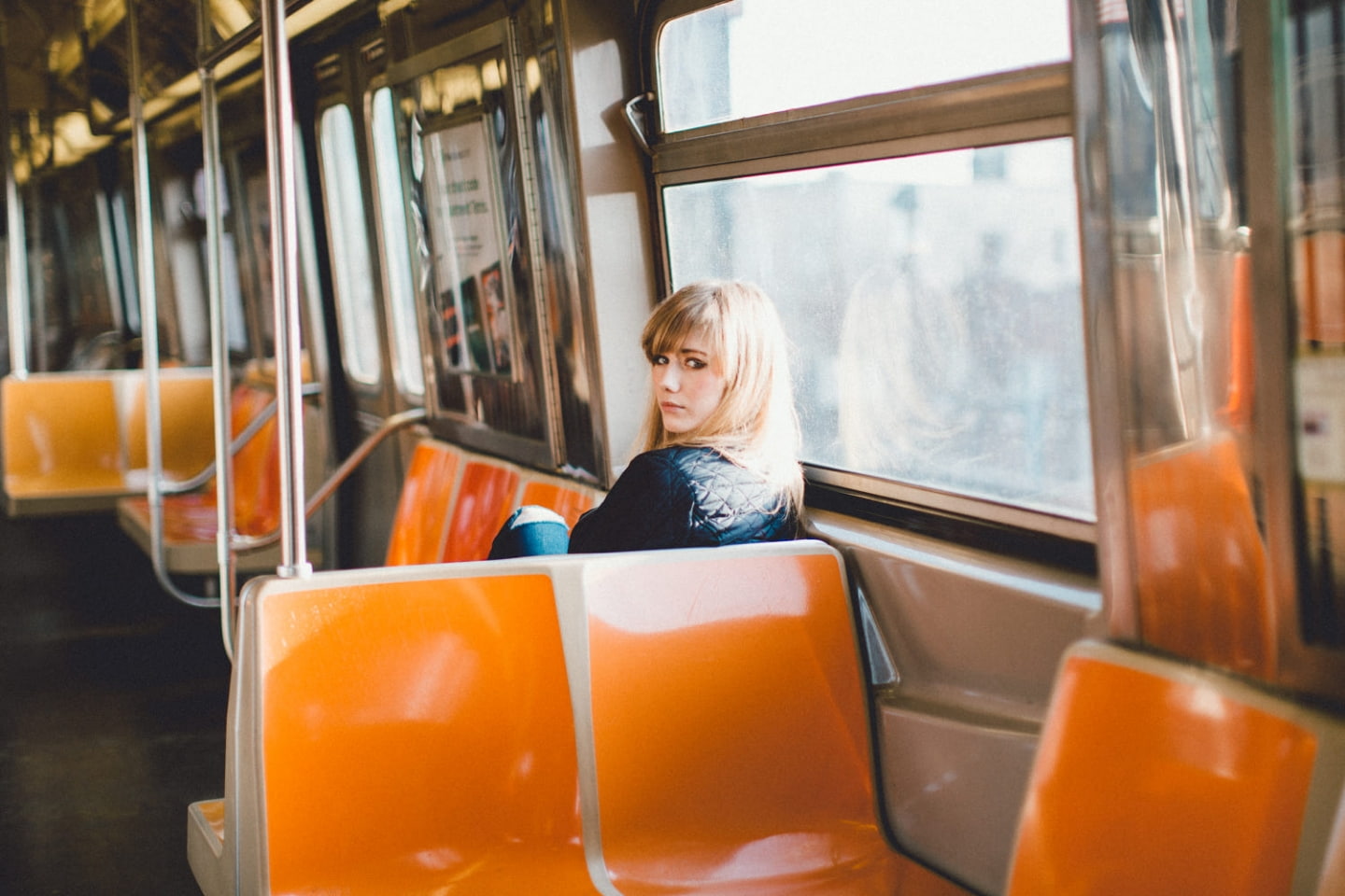 sitting, New York City, train, waiting, long hair, one person, vehicle, contemplation, looking back, blond hair, casual clothing, vehicle interior, people, HD Wallpaper