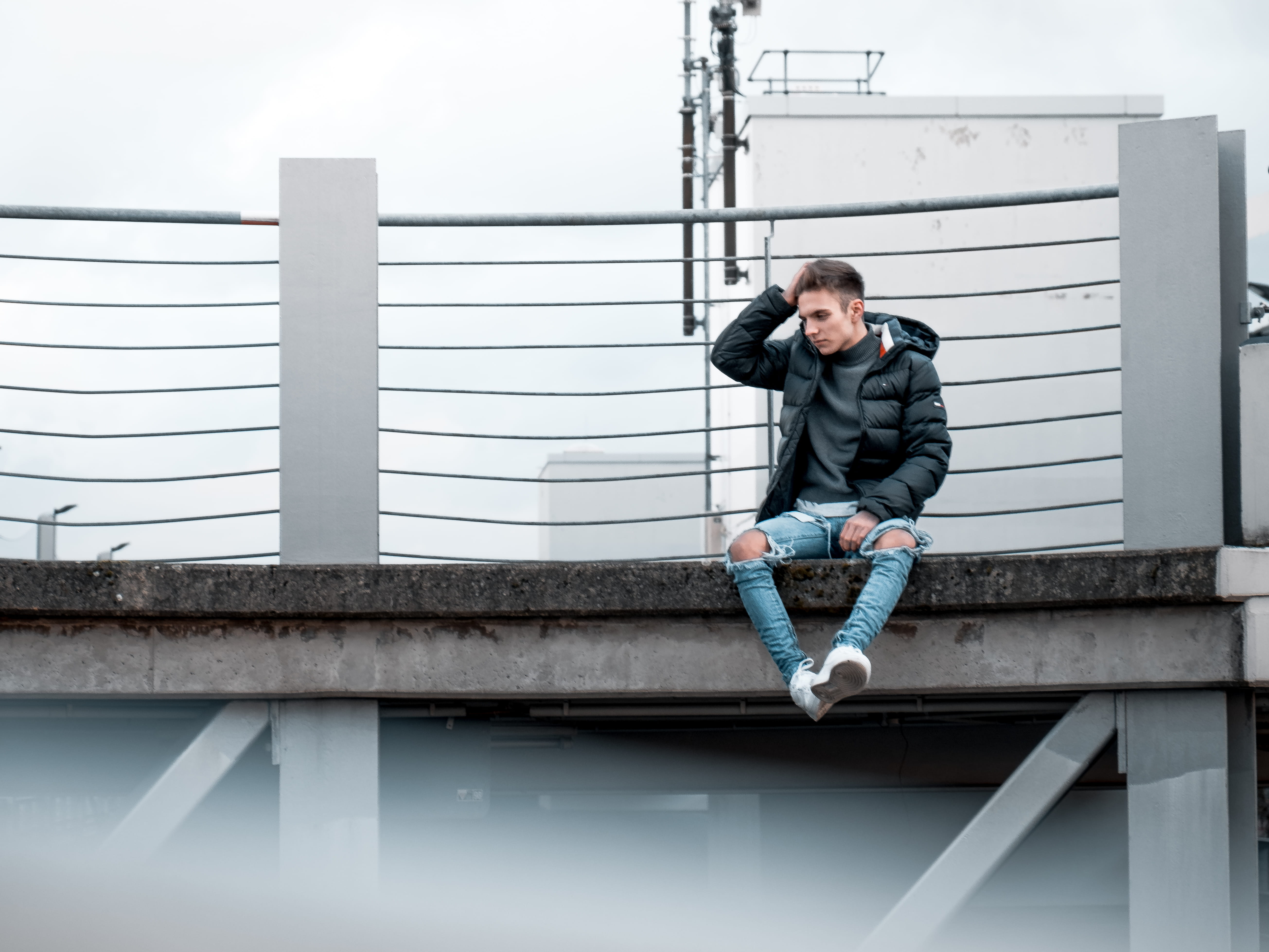 footwear, railing, adult, cgn, cologne, real people, germany, sitting, shoe, one person, lifestyles, jacket, architecture, person, built structure, front view, HD Wallpaper