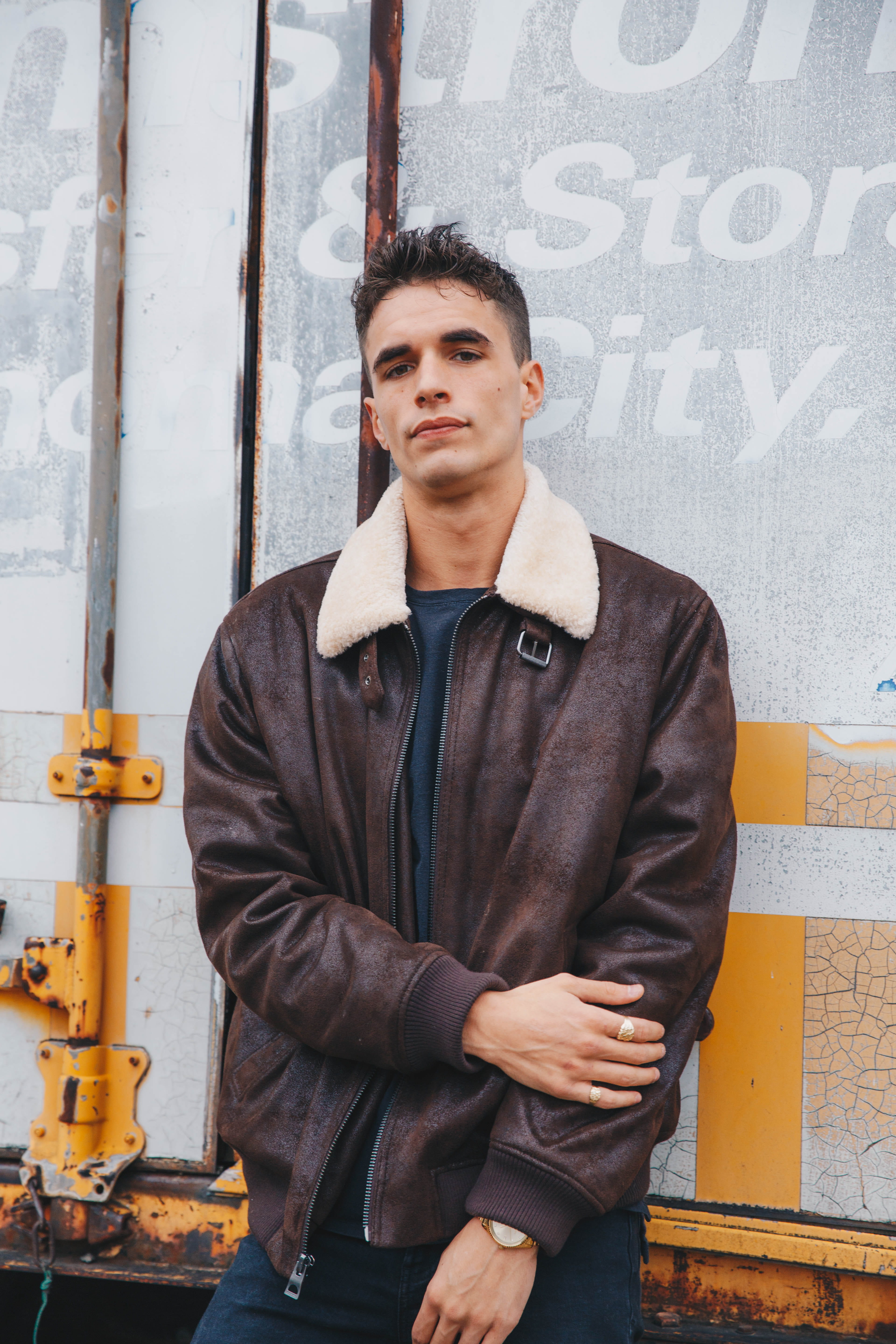 wearing, person, lifestyles, real people, leather jacket, young men, overcoat, coat, portrait, looking at camera, brass section, worker, man, contemplation, Phone HD Wallpaper