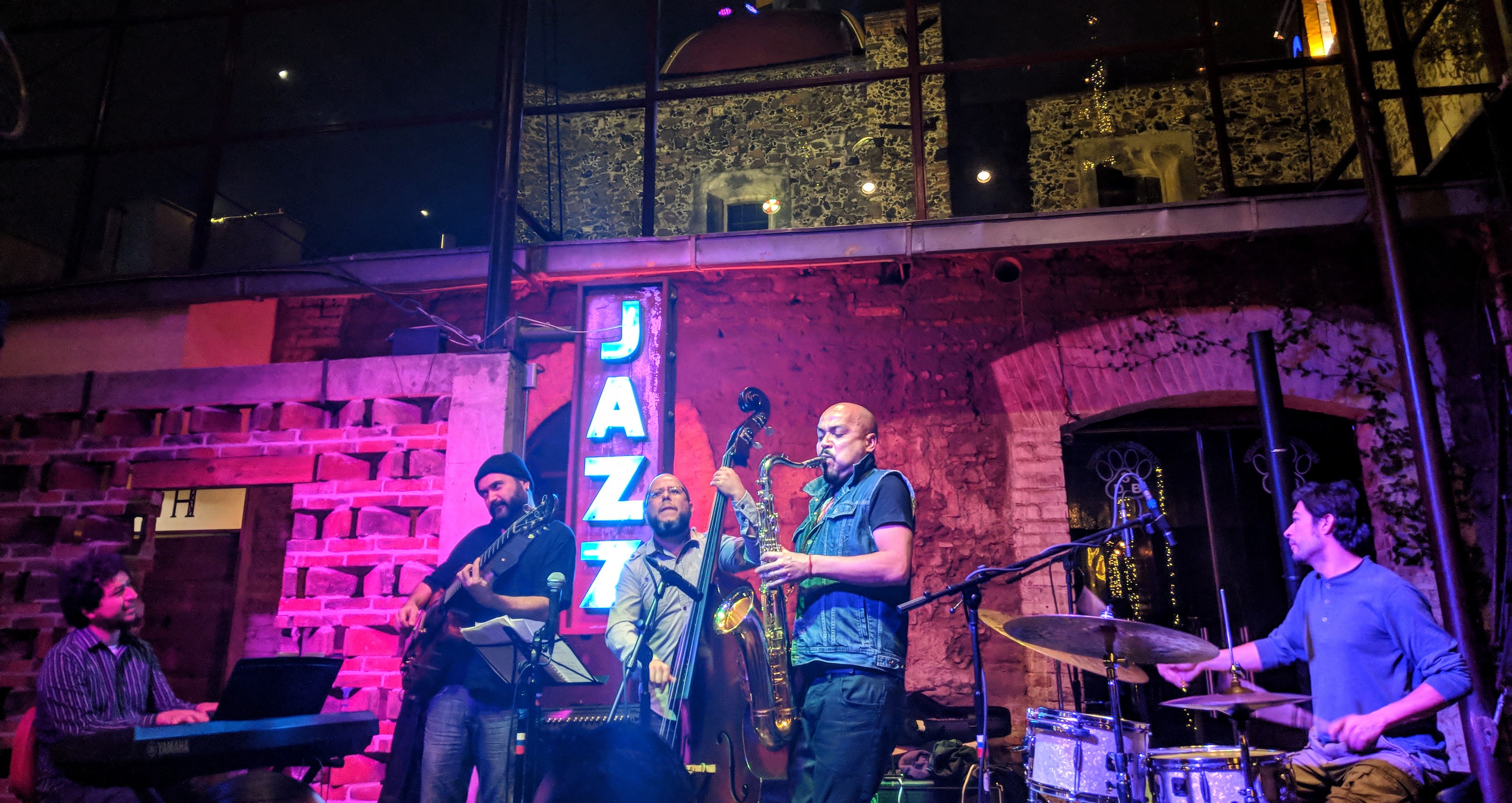 av 2 ote 406, nightlife, musical instrument, saxophone, men, young adult, standing, illuminated, architecture, night, leisure activities, music band, lighting, HD Wallpaper