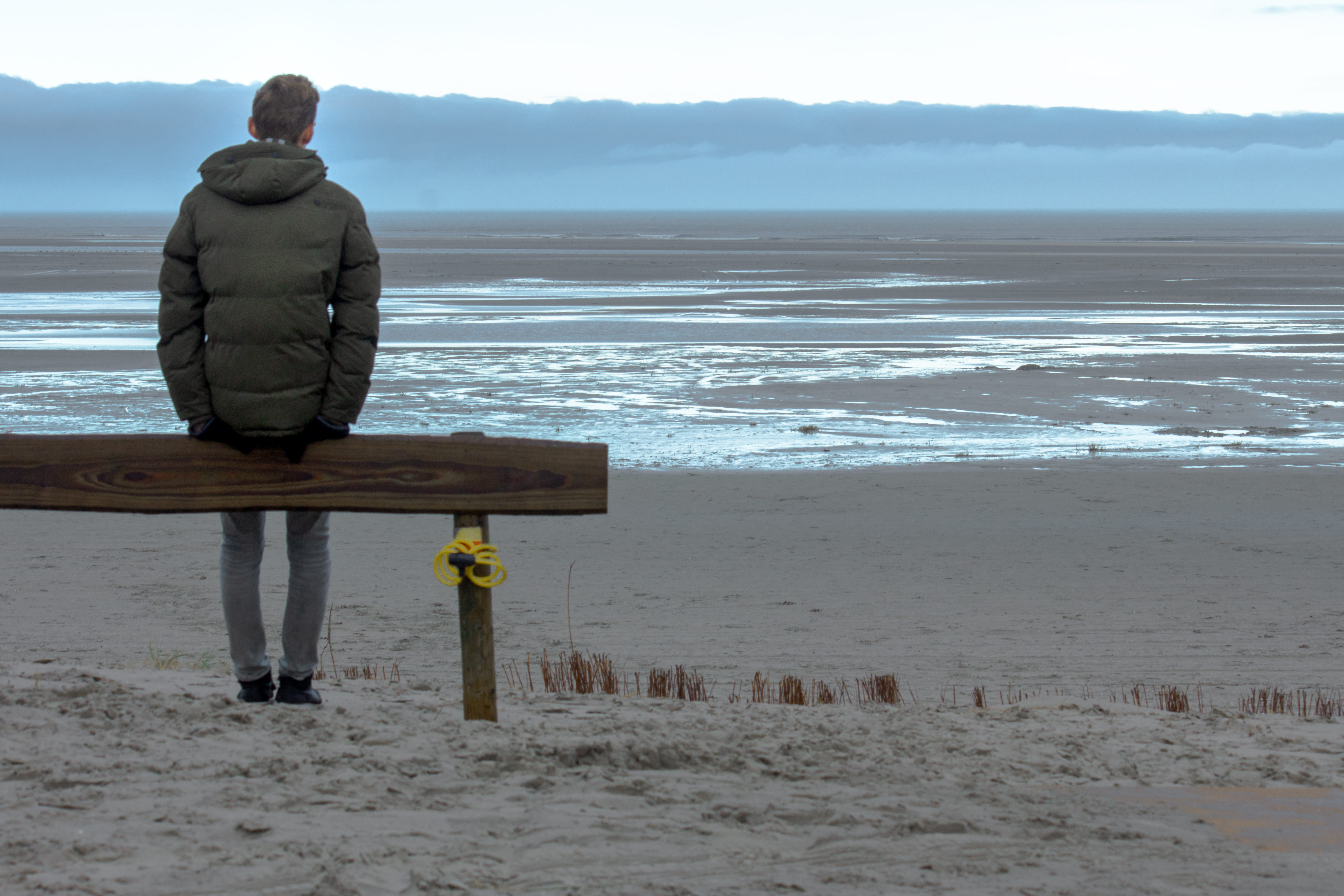 man, land, tranquil scene, wooden post, person, nature, looking at view, water, sea, beach, real people, day, outdoors, full length, scenics - nature, mood, HD Wallpaper