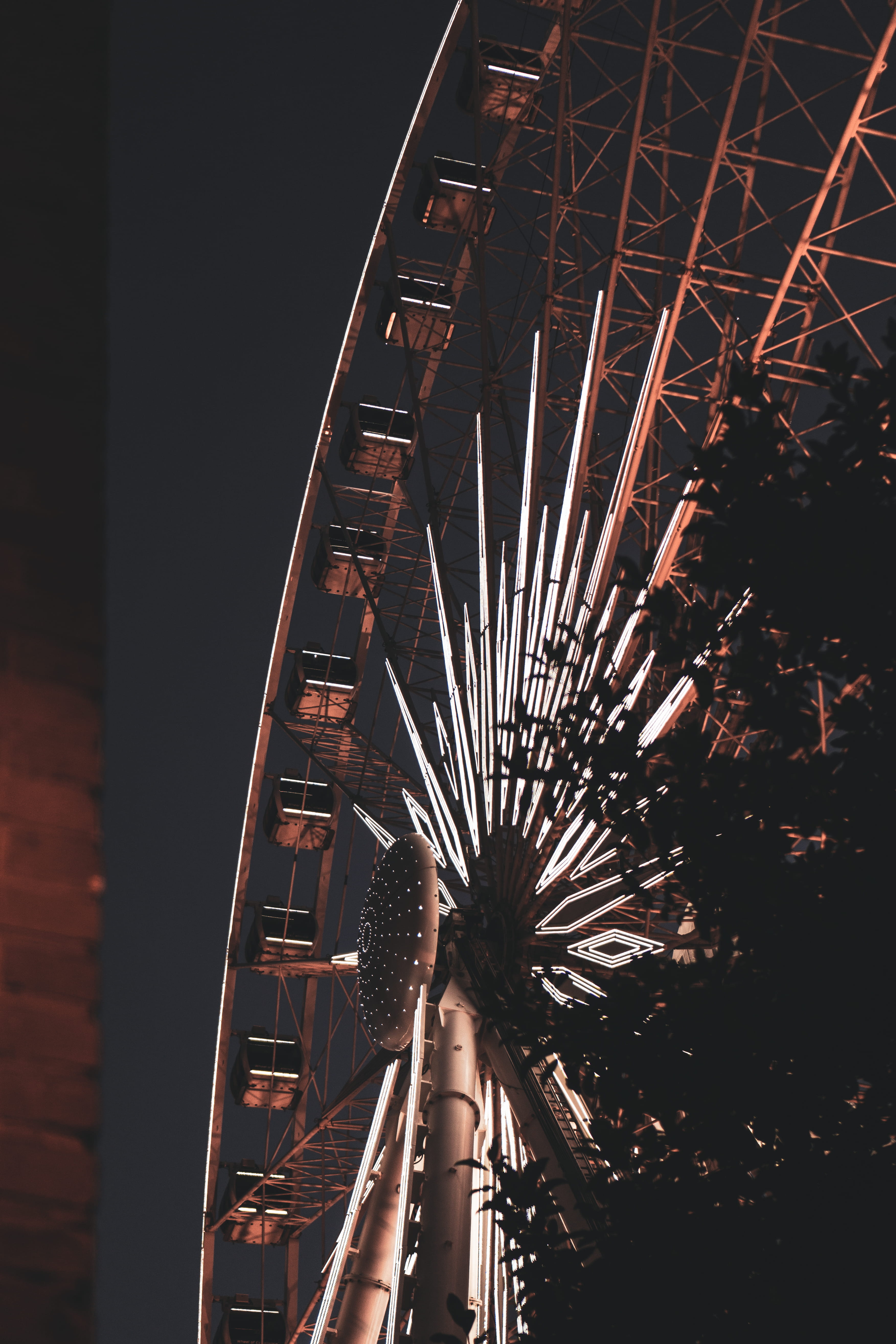 building Exterior, tower, tree, night, cultures, moody photography, steel, architecture, silhouette, city Life, wheel, ferris Wheel, modern, metal, blue, Phone HD Wallpaper
