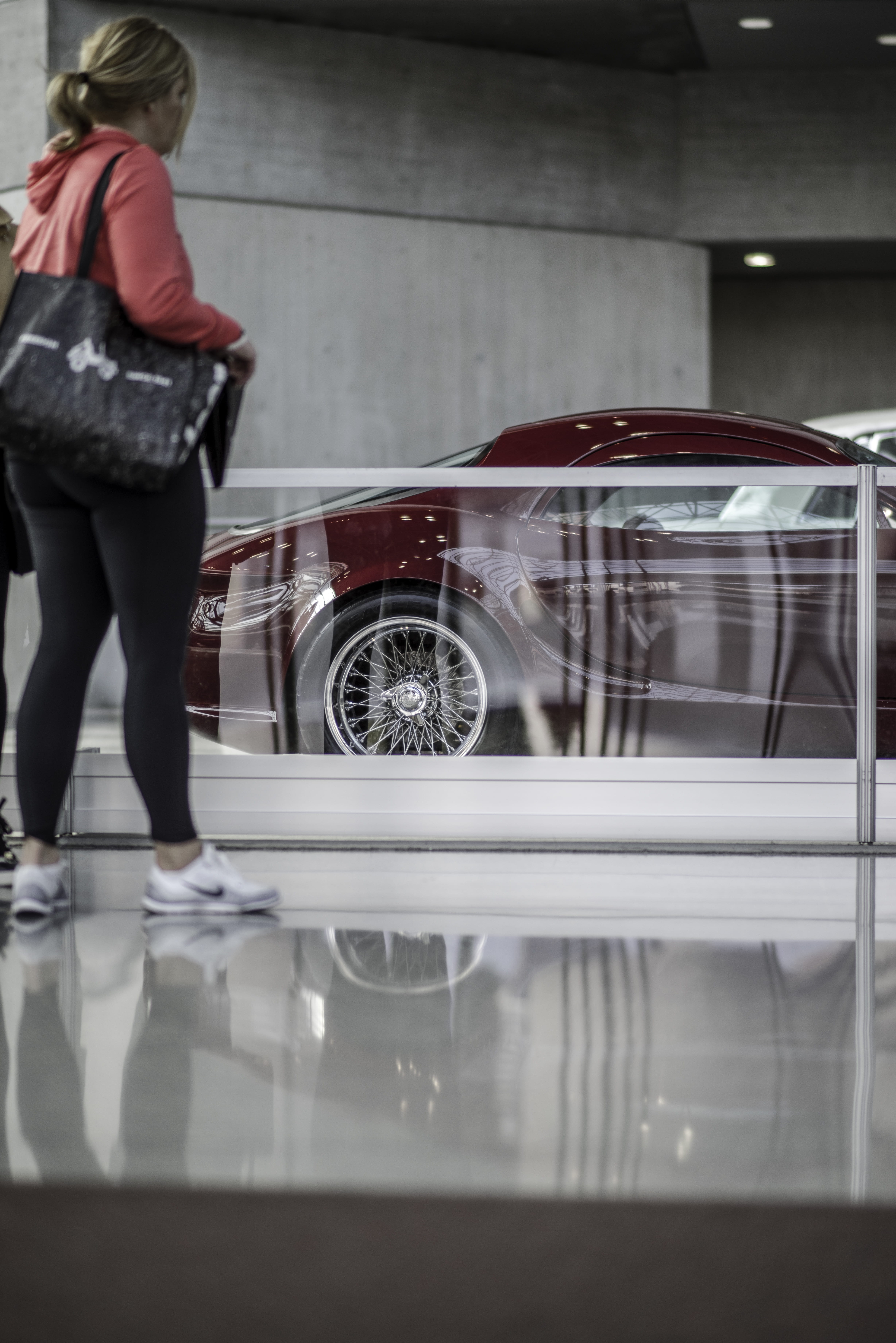 5K, mode of transportation, glass - material, wearing, car, red, rear view, standing, day, casual clothing, daytime, stance, glass, indoors, pants, woman, Phone HD Wallpaper