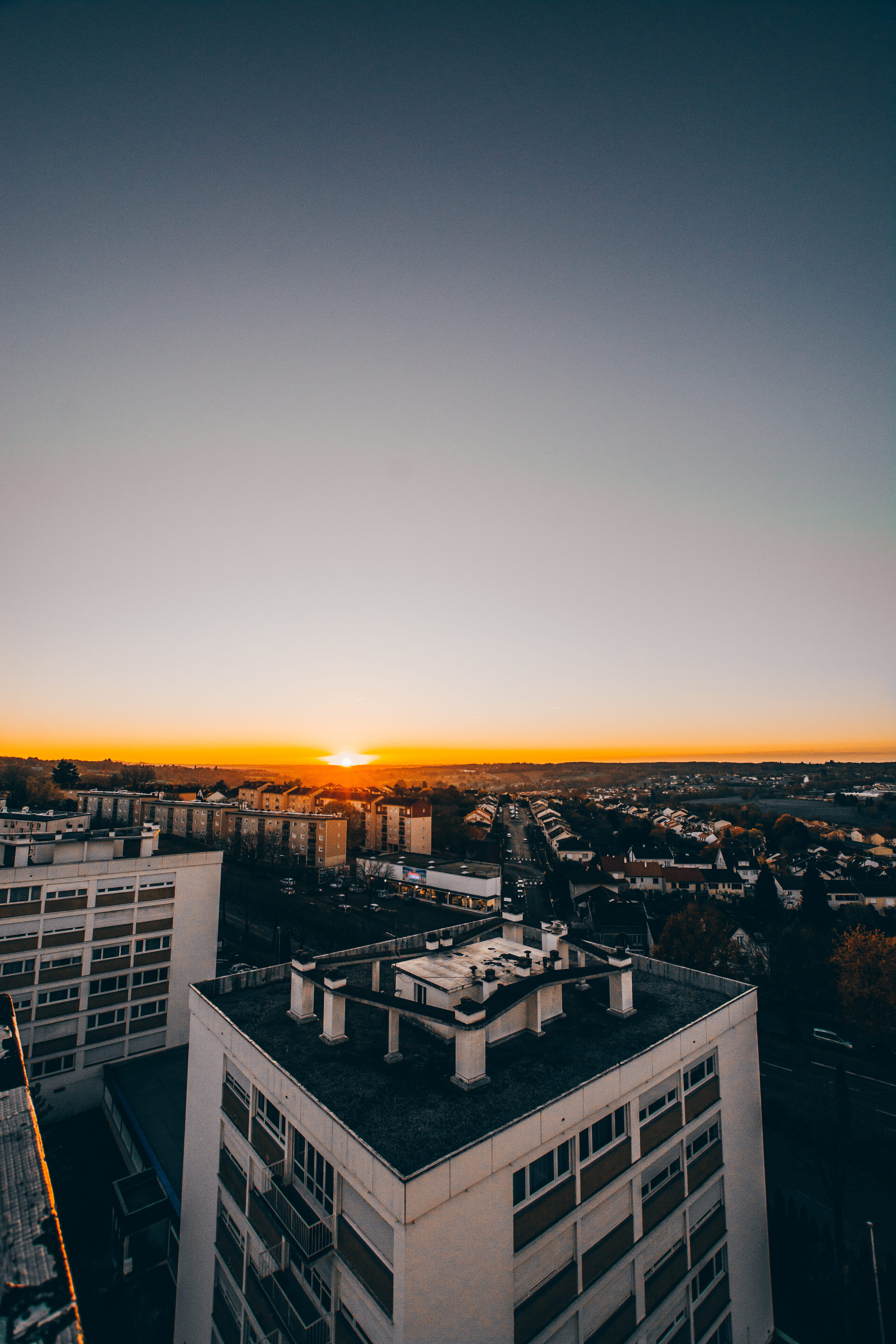high, nature, town, settlement, aerial, city life, hour, high angle view, office building, townscape, city scape, sunset, night time, sky, sun, gradient, Phone HD Wallpaper
