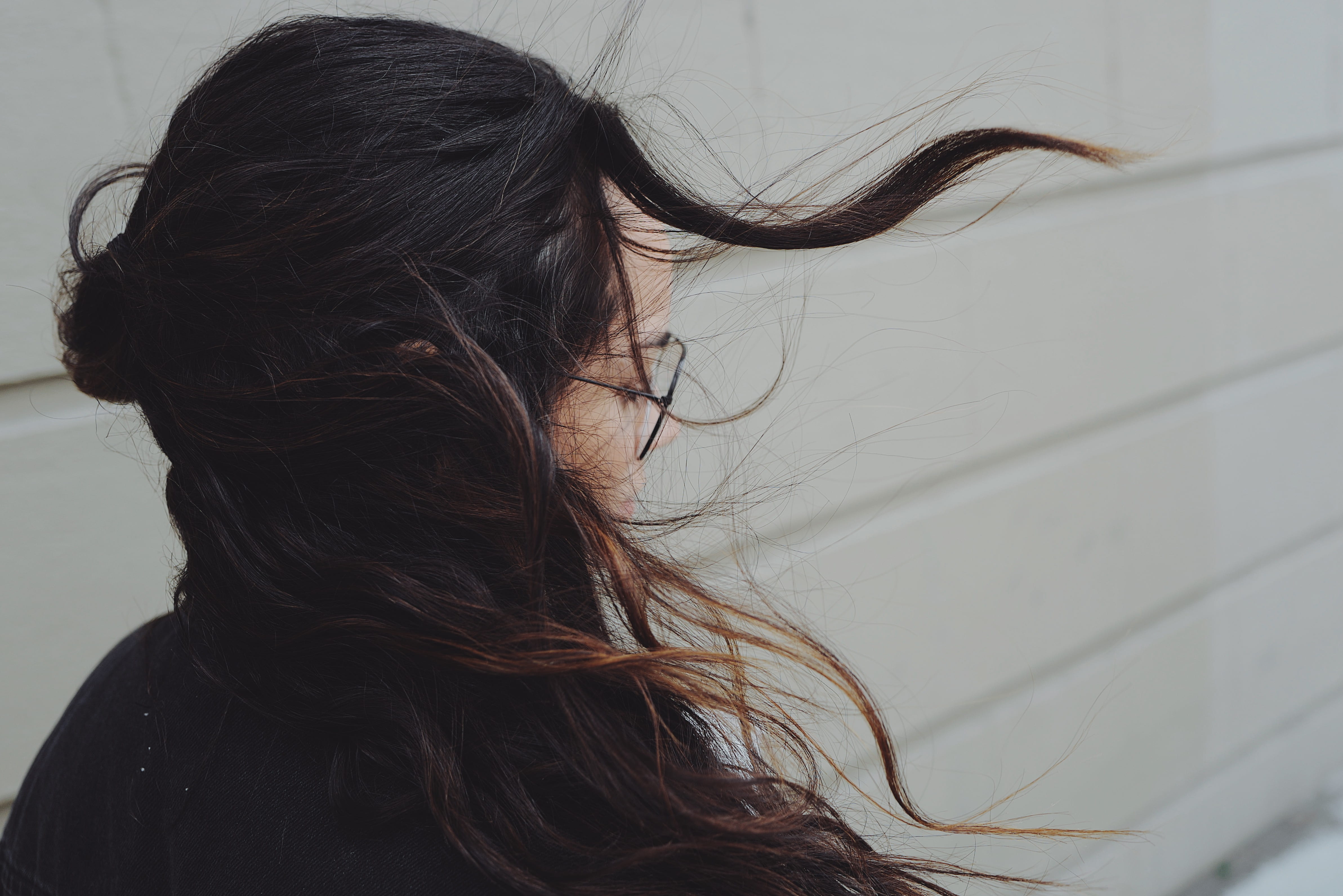 brown hair, getting, windy, black, eye, one person, young women, human face, young adult, head, near, profile view, close-up, city, woman, glasses, girl, HD Wallpaper