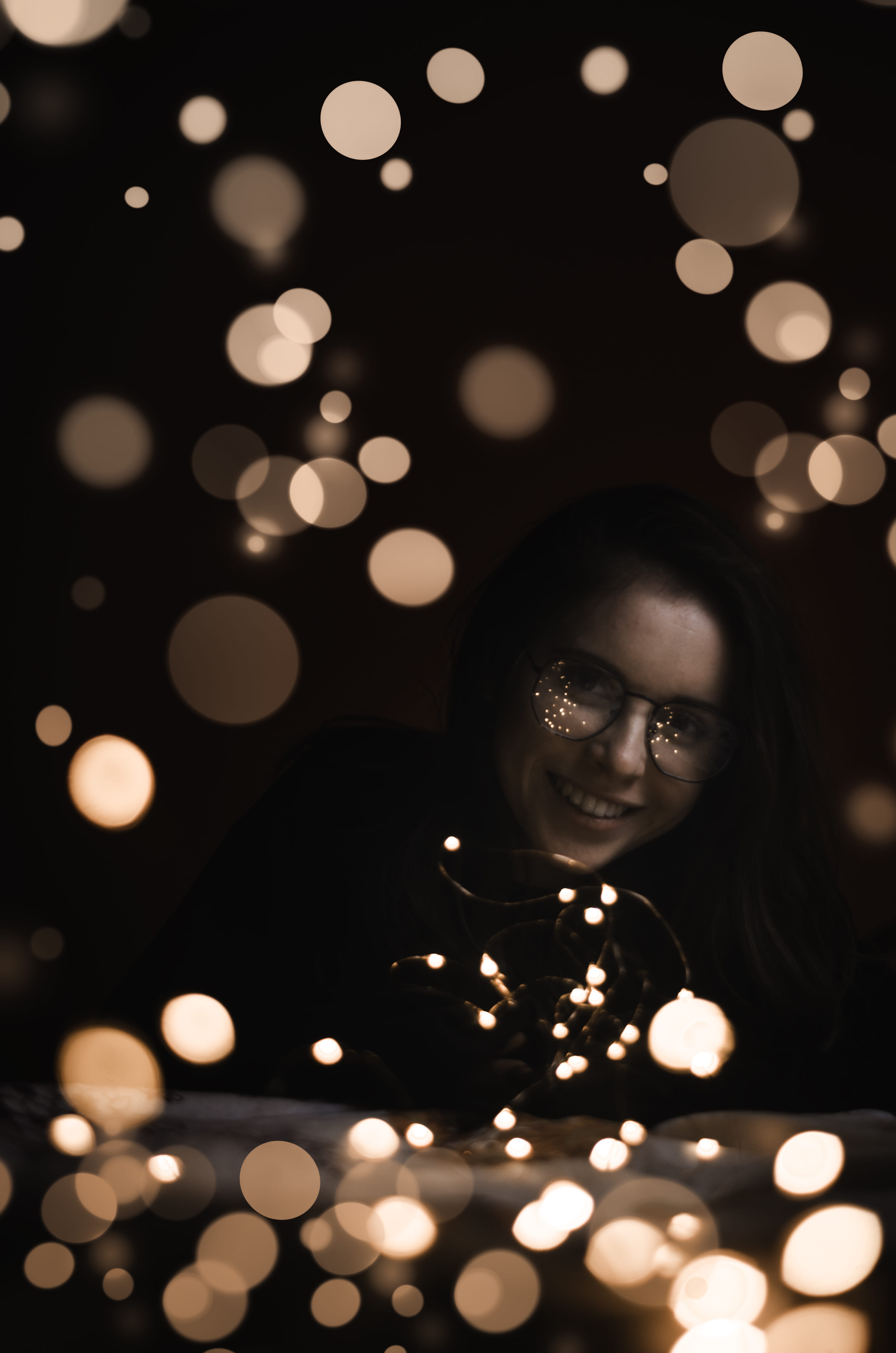 glowing, 4K, wearing, light - natural phenomenon, headshot, light, vigil, flower, finger, black, framed, young women, shirt, indoors, bokeh, flame, woman, Phone HD Wallpaper