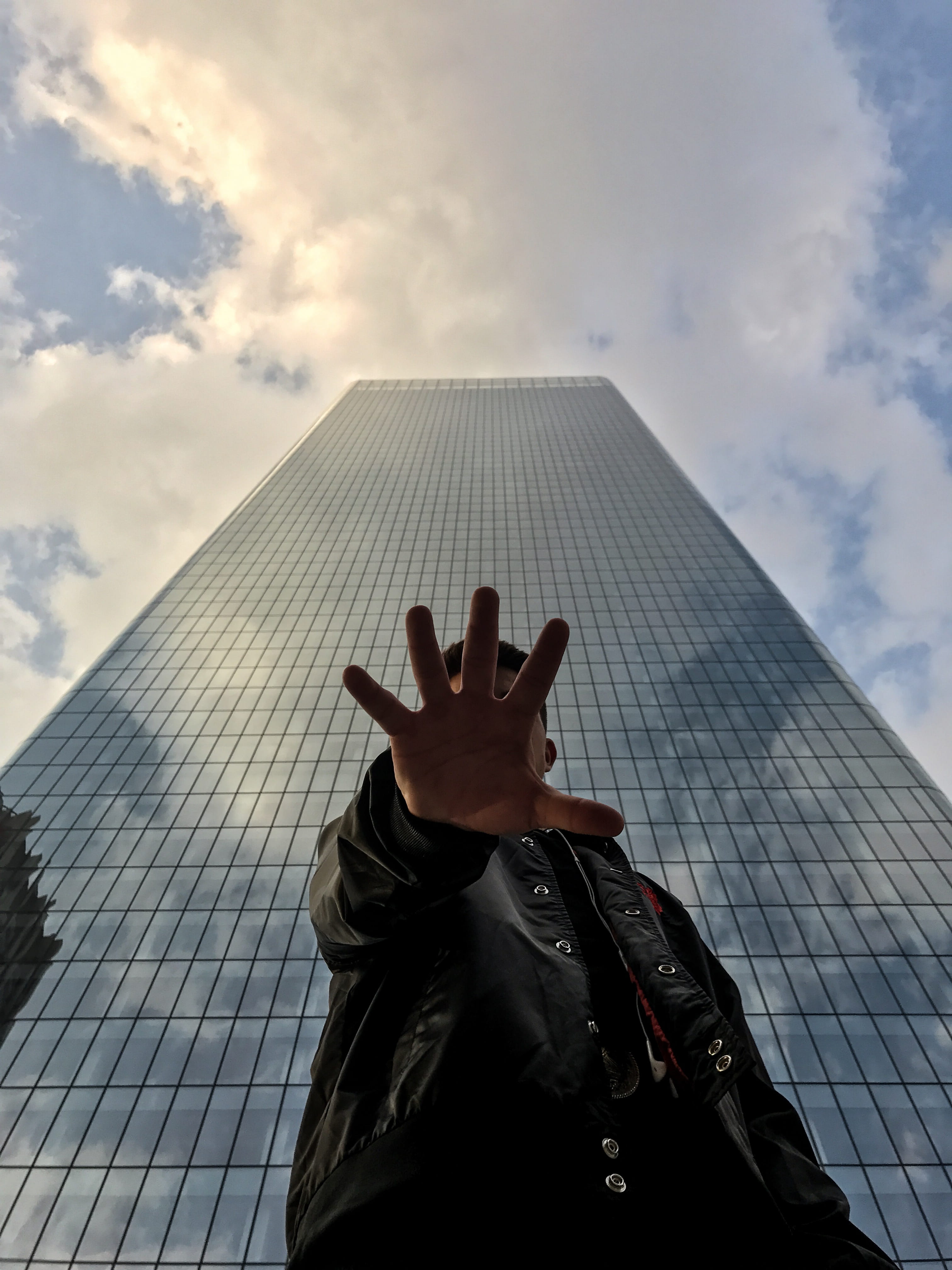 low angle view, skyscraper, face, city, buildings, human finger, built structure, people, unrecognizable person, outdoors, calgary, person, one person, Phone HD Wallpaper