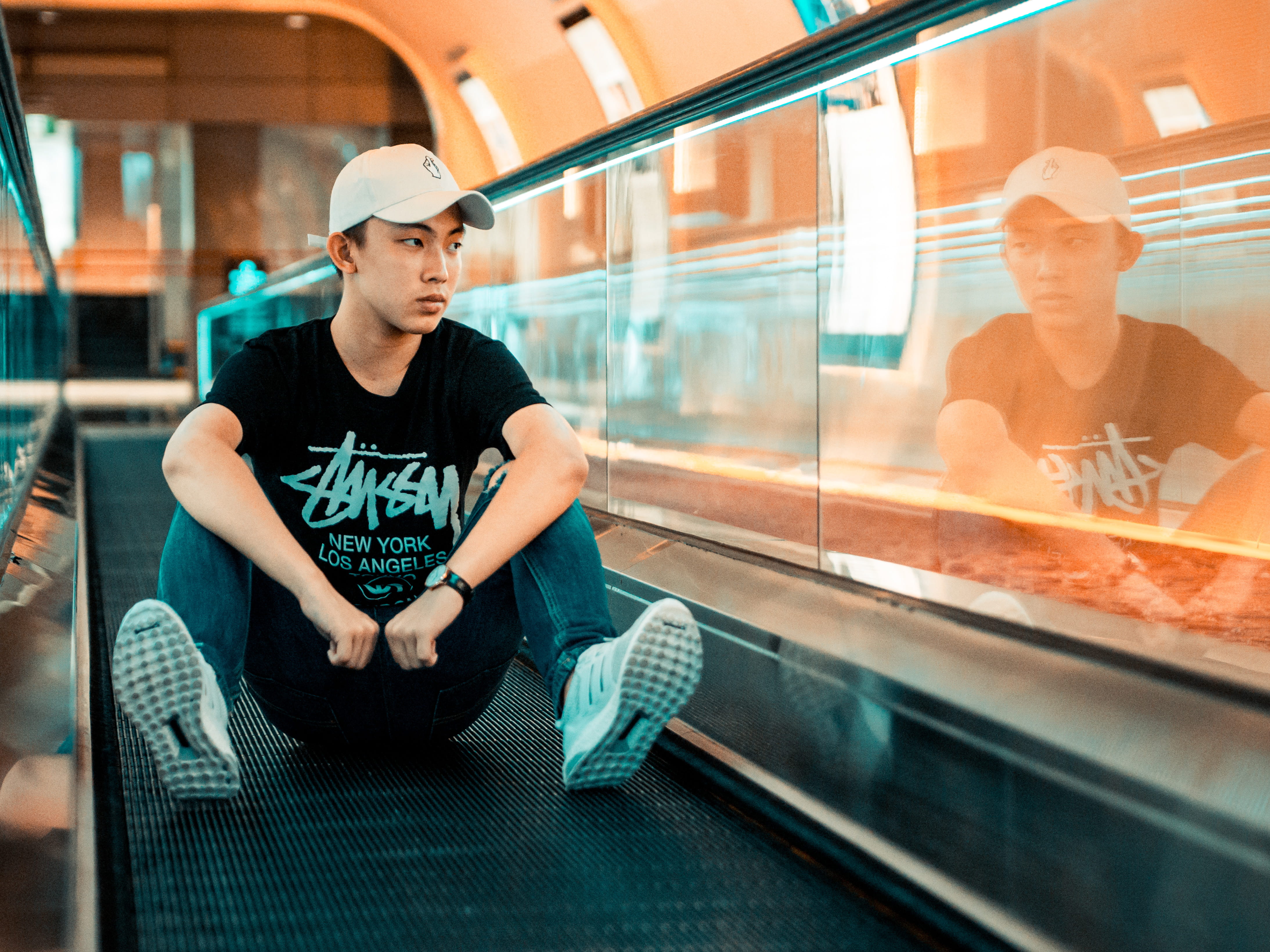 teal orange, cap, window, street fashion, adolescence, teenager, leisure activity, young men, contemplation, real people, 4K, sitting, front view, adult, HD Wallpaper