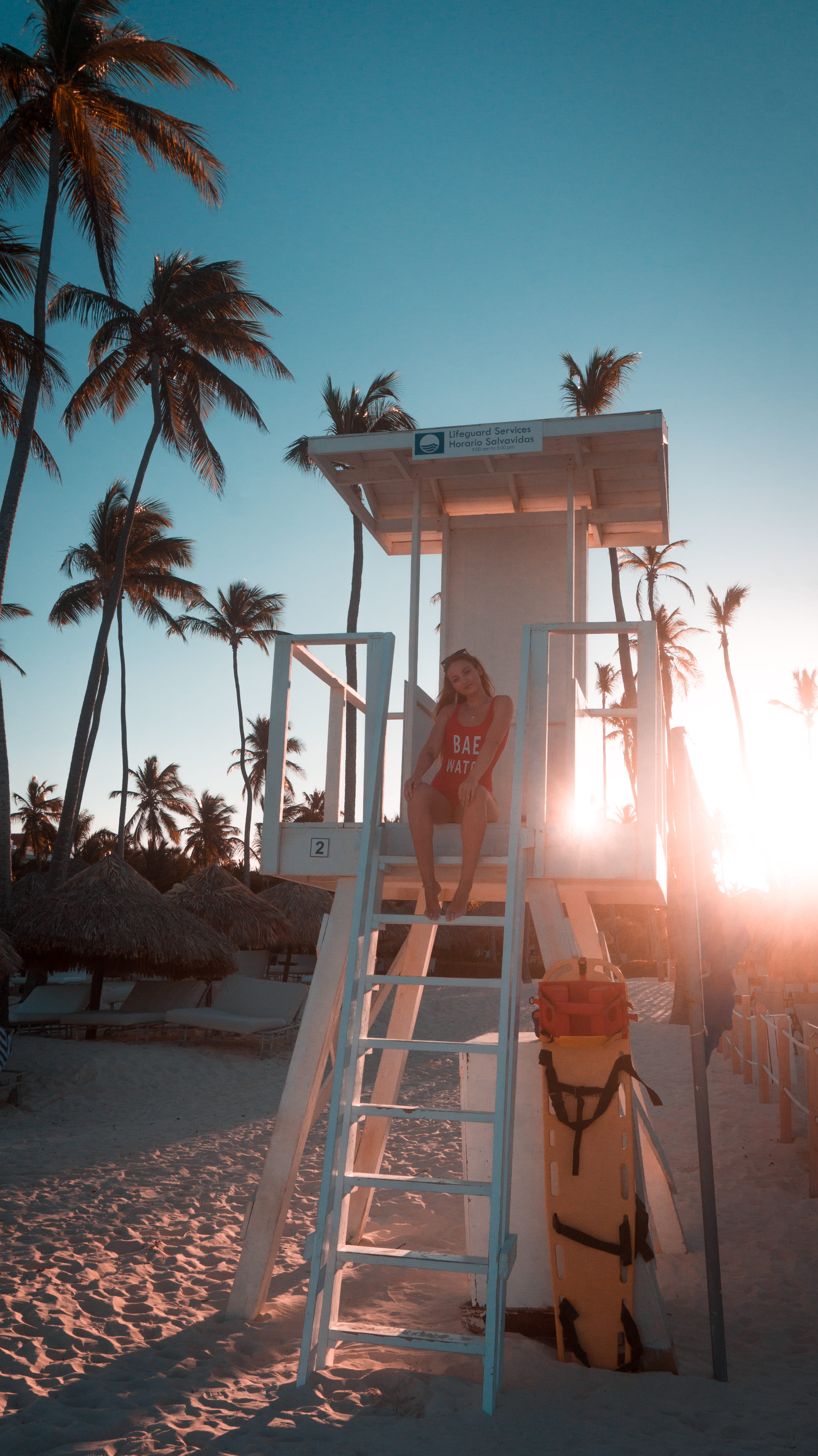 human, plant, sunlight, chair, person, land, outdoors, woman, real people, nature, flare, men, bavaro beach, full length, sitting, one person, dominican republic, Phone HD Wallpaper