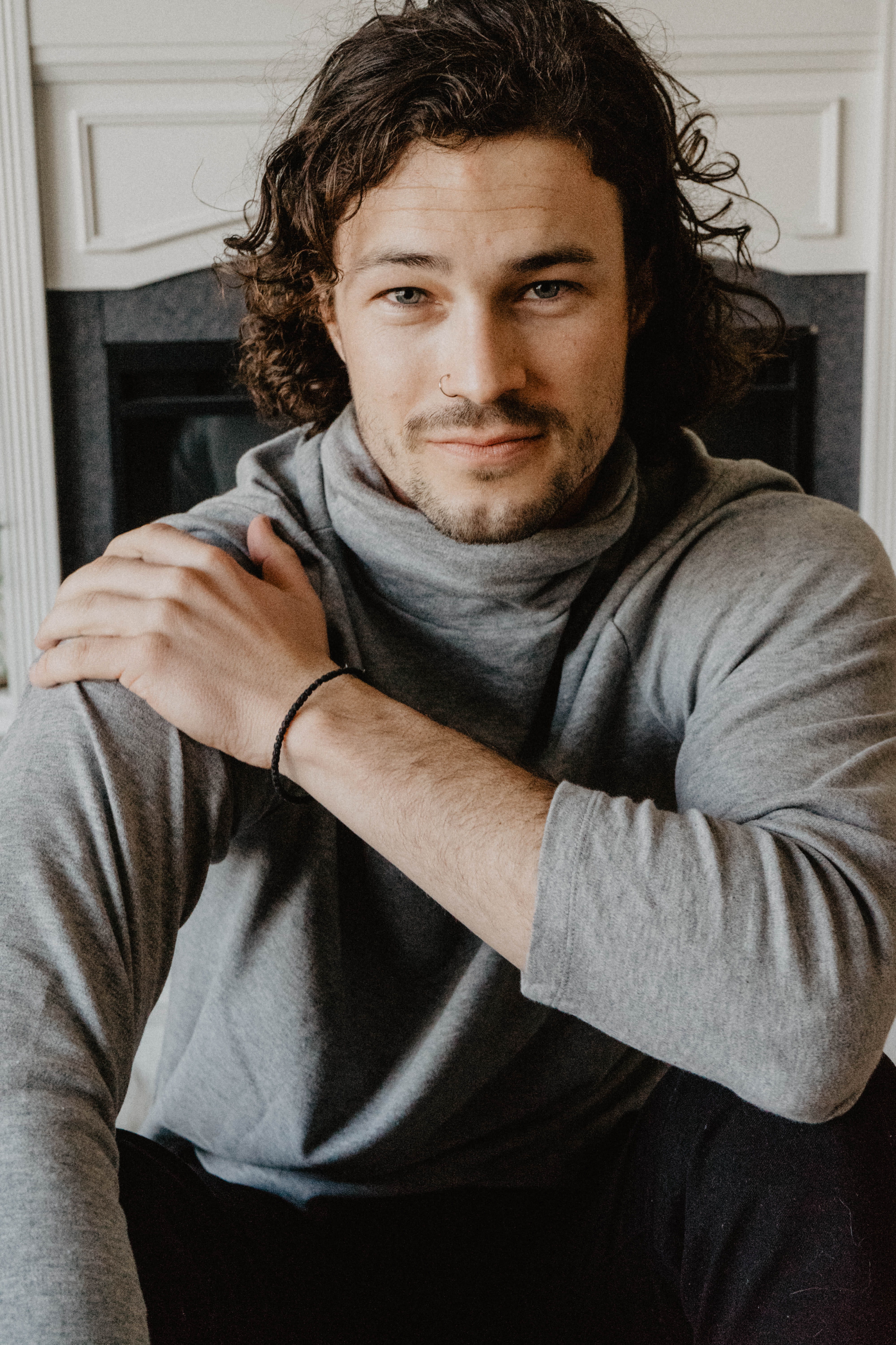 one person, home interior, handsome, young adult, fireplace, young men, front view, long, leisure activity, sitting, near, facial hair, male, indoors, hairstyle, Phone HD Wallpaper