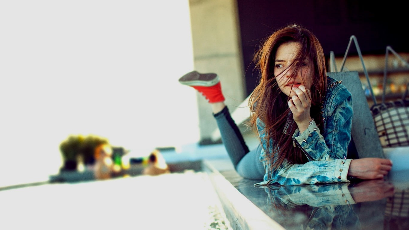 sneakers, 720P, looking away, women, lying on front, jean jacket, model, legs up, hair in face, redhead, HD Wallpaper