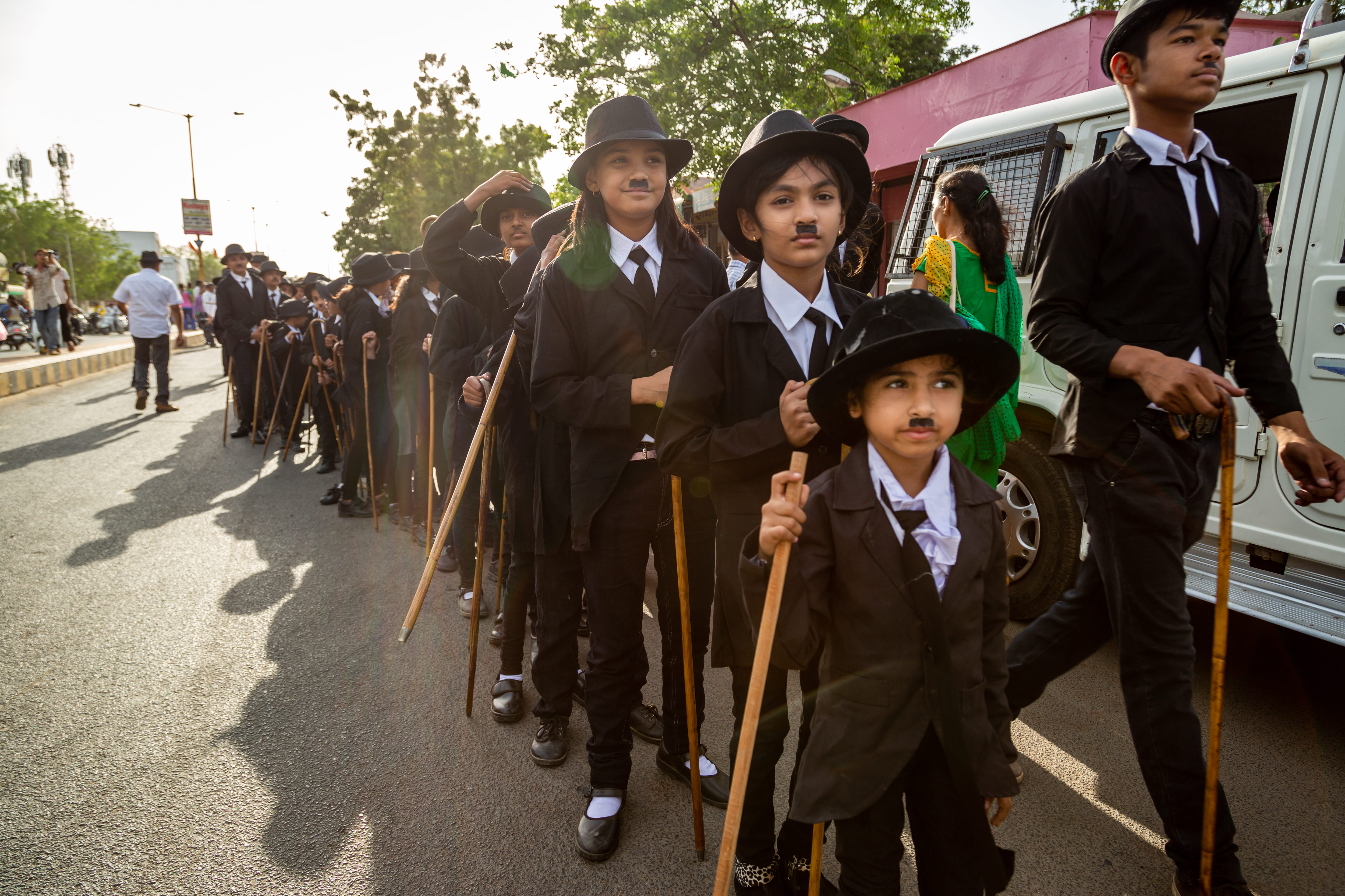 stick, real people, outdoors, boys, childhood, girls, unique, togetherness, child, human, coat, tripod, person, sun hat, tough, front view, charlie chaplin, HD Wallpaper