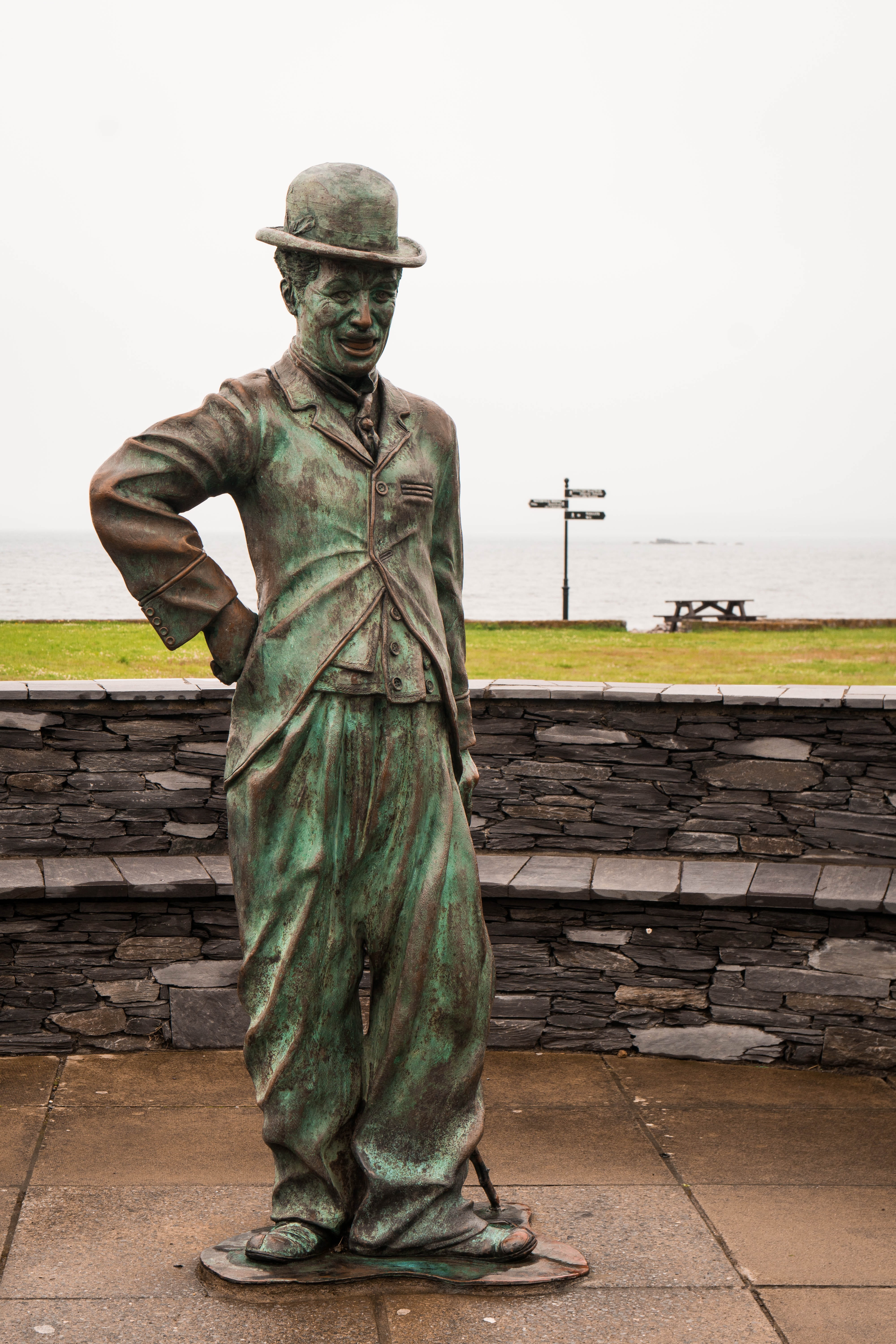 chaplin, adult, sky, figure, ireland, human, hat, 5K, art, costume, nature, human representation, green color, one man only, Actor, laugh, cinema, waterville, Phone HD Wallpaper