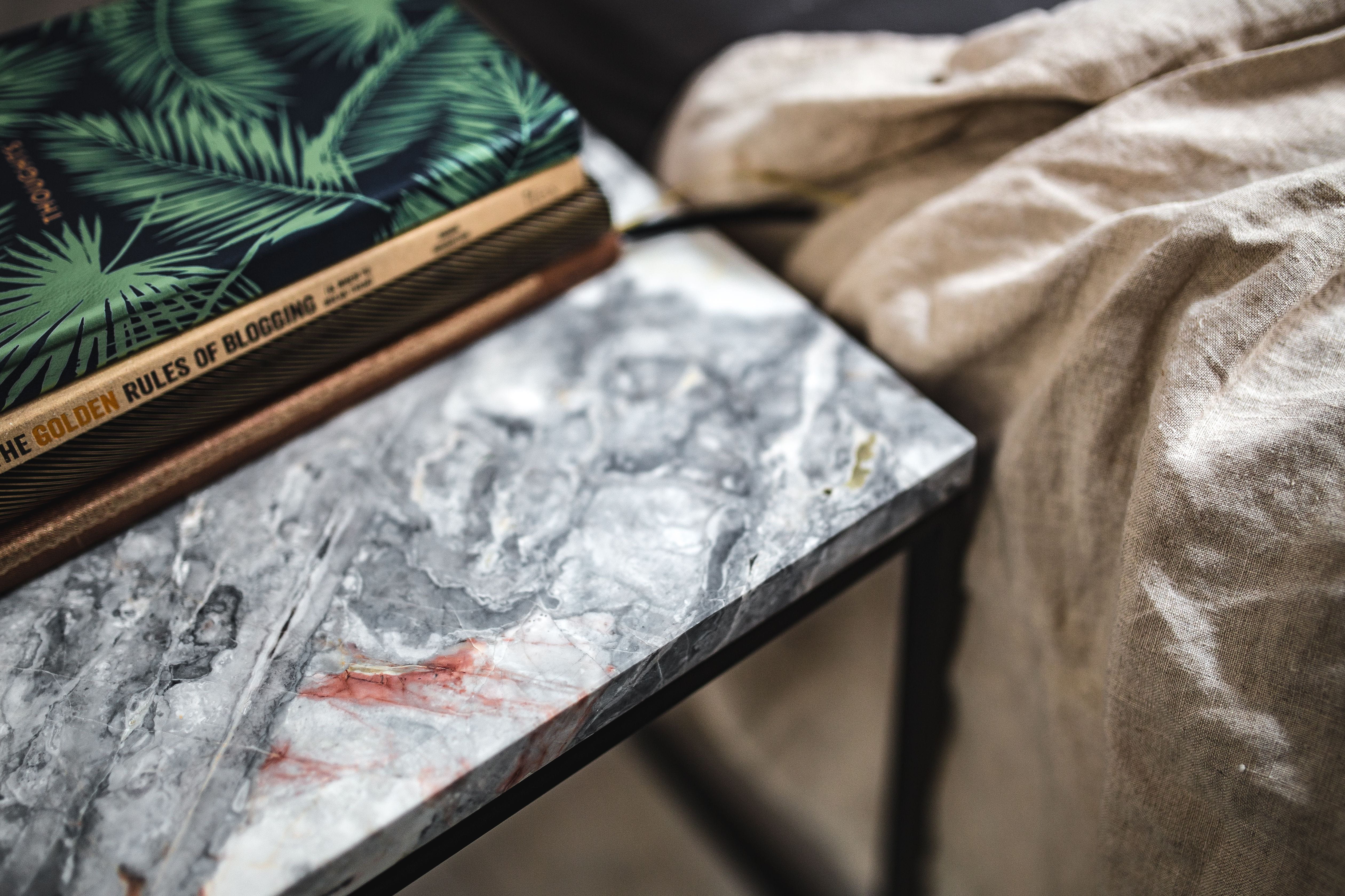 plant part, book, close-up, marble table, nature, 4K, day, textured, Uncommon, selective focus, focus on foreground, leaf, books, metal, indoors, wood - material, HD Wallpaper