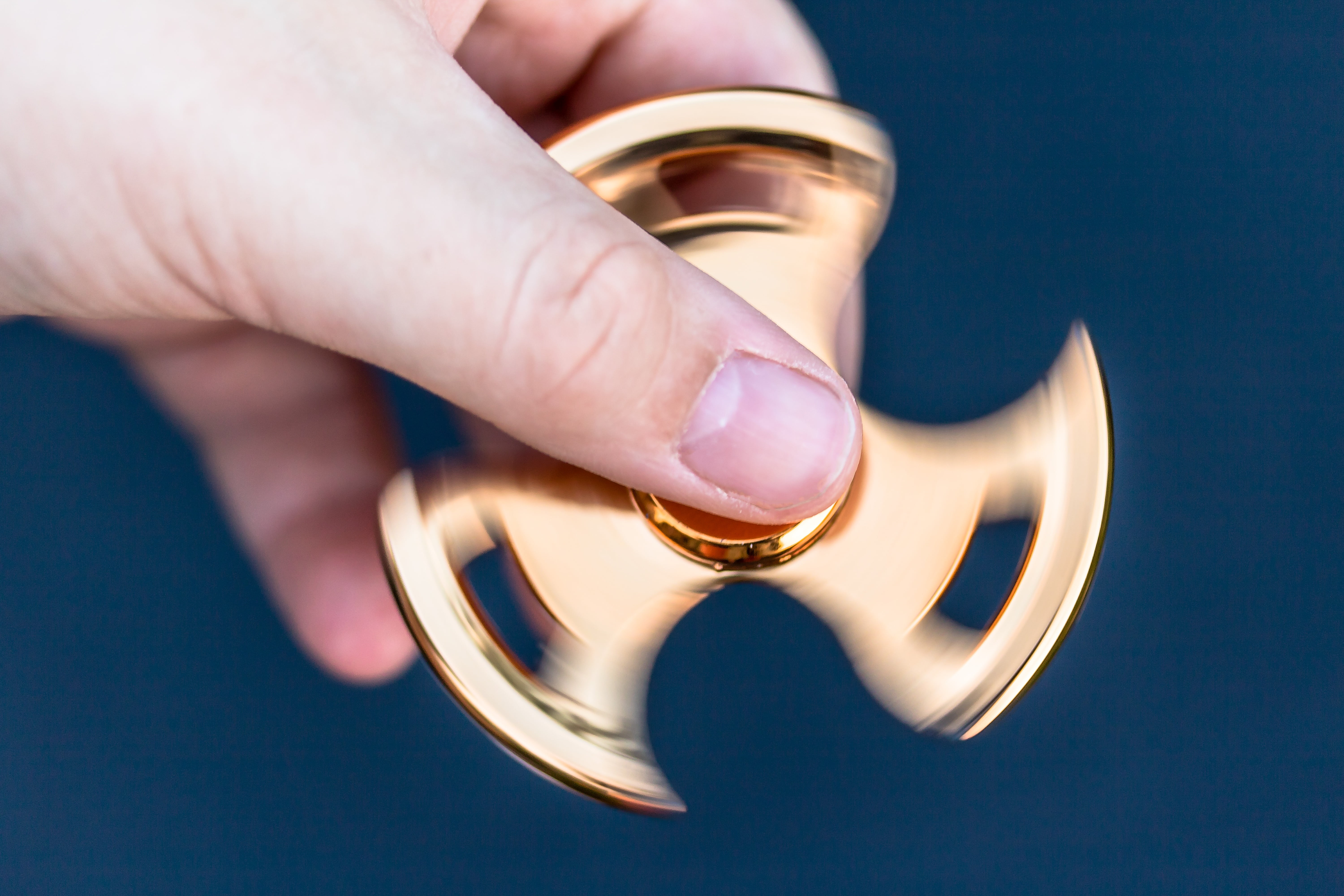 fidget spinner, people, colored background, close-up, gold, blade, day, ball bearings, metal, in rotation, outdoors, fun, holding, spinner, 5K, human body part, HD Wallpaper