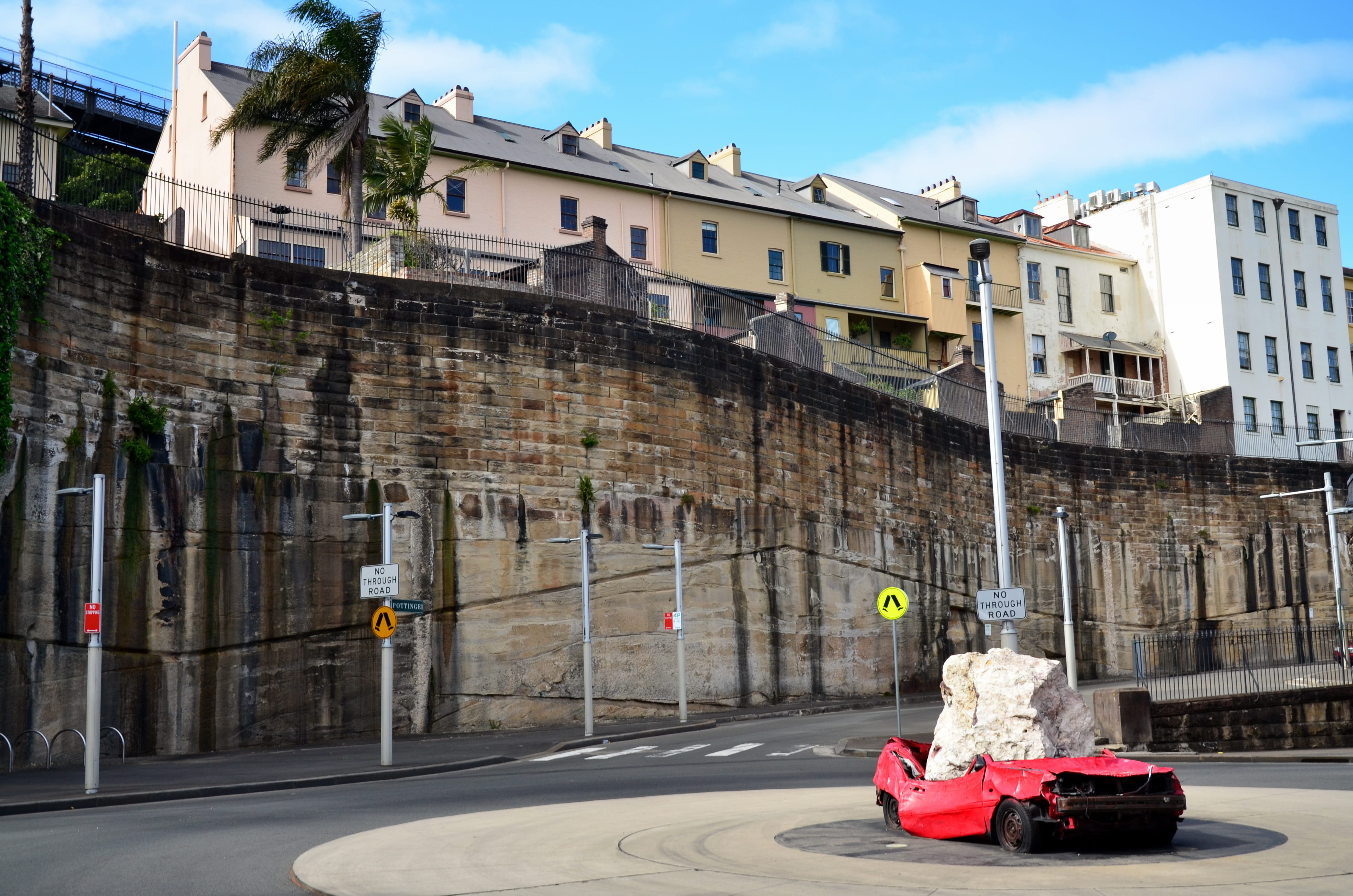 building, outdoors, architecture, motor vehicle, cloud - sky, wall, car, sky, the rocks, mode of transportation, transportation, sunlight, houses, residential district, HD Wallpaper