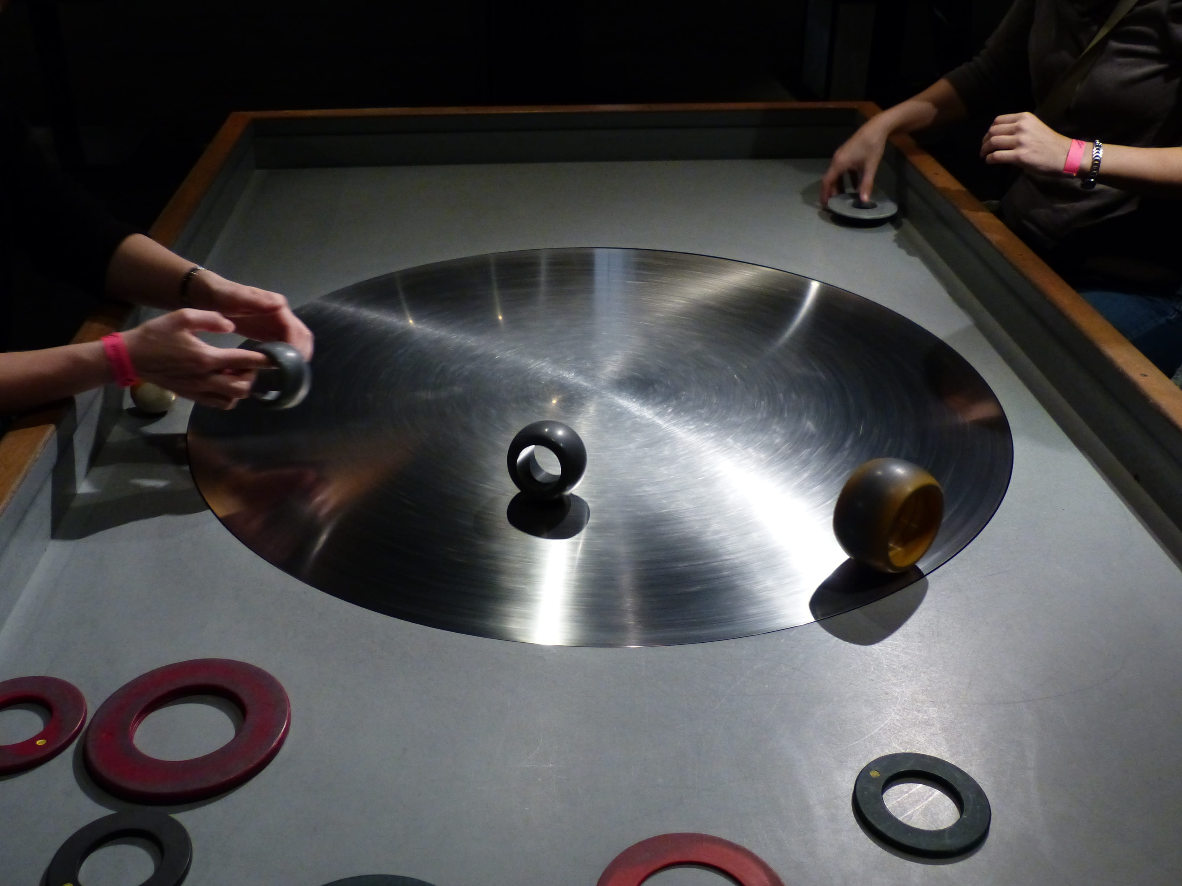 playing, metal, holding, finger, ball, roundabout, men, adult, human body part, hub, hand, body part, real people, skill, indoors, one person, museum, women, HD Wallpaper