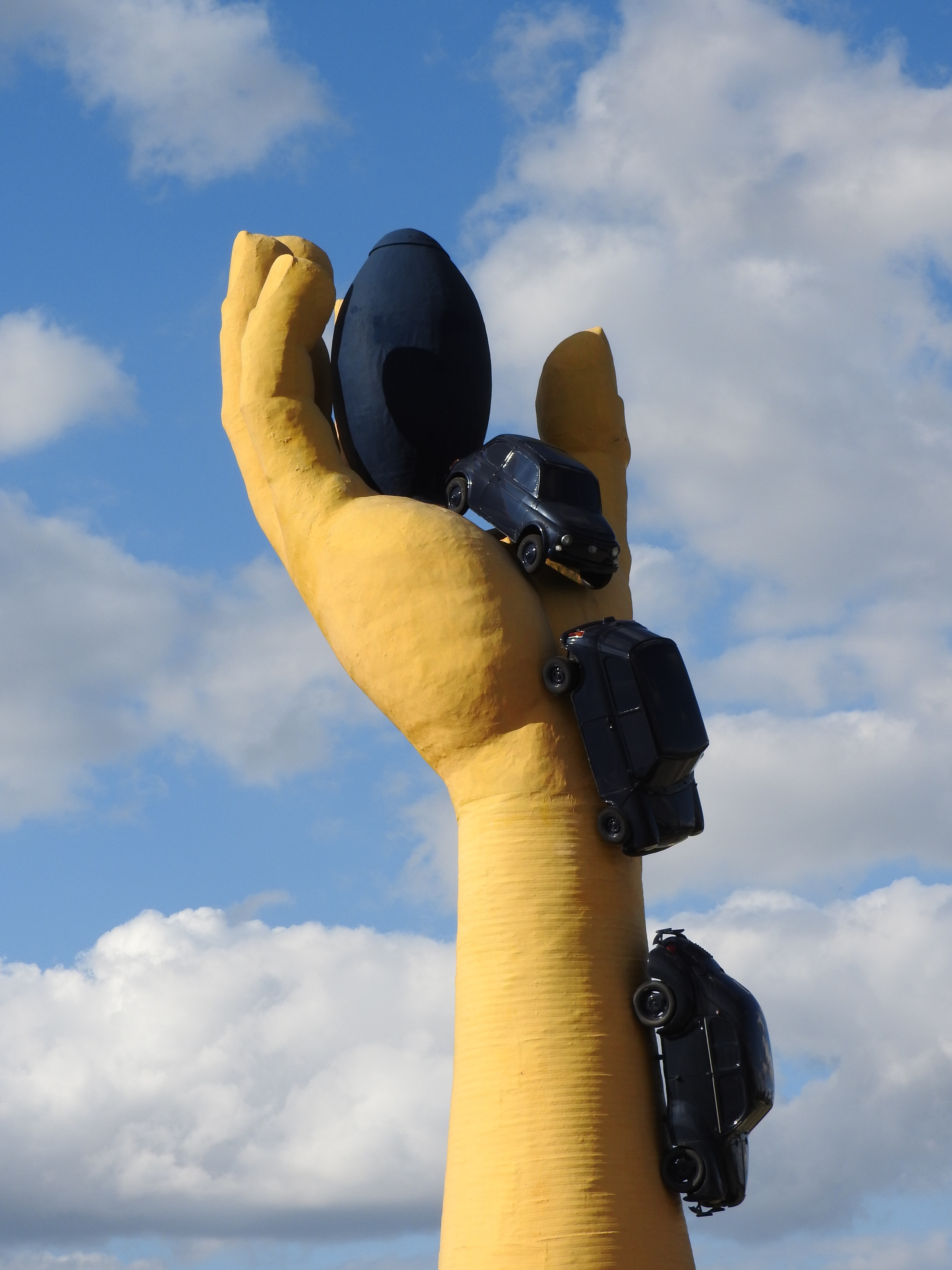 one person, rond point, cloud - sky, human hand, outdoors, yellow hand, day, hand, finger, technology, holding, sculpture, camera - photographic equipment, Phone HD Wallpaper