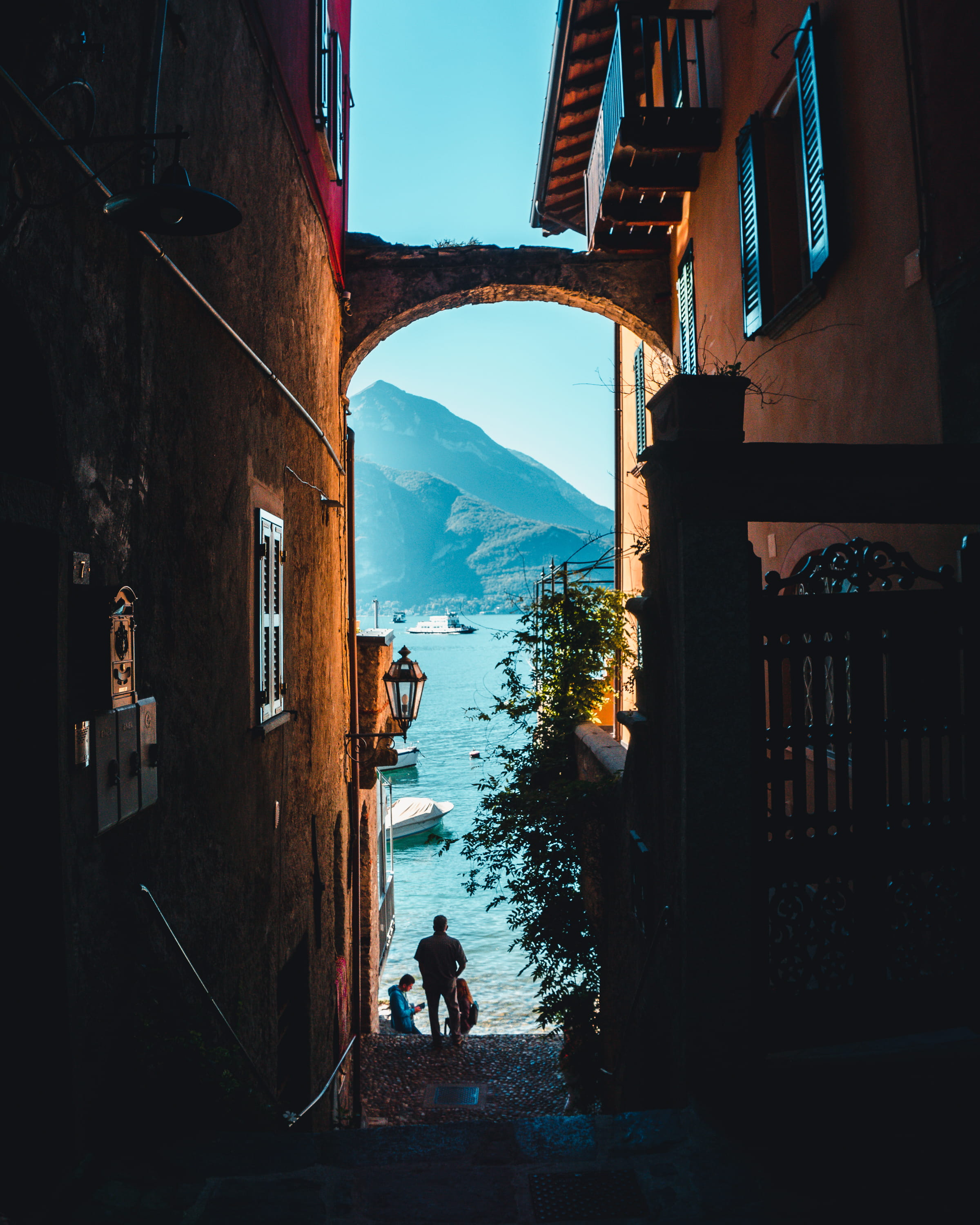 real people, architecture, building exterior, como lake, lifestyles, alley, residential district, day, teal, lago, lake, sky, italy, outdoors, city, shadows, Phone HD Wallpaper