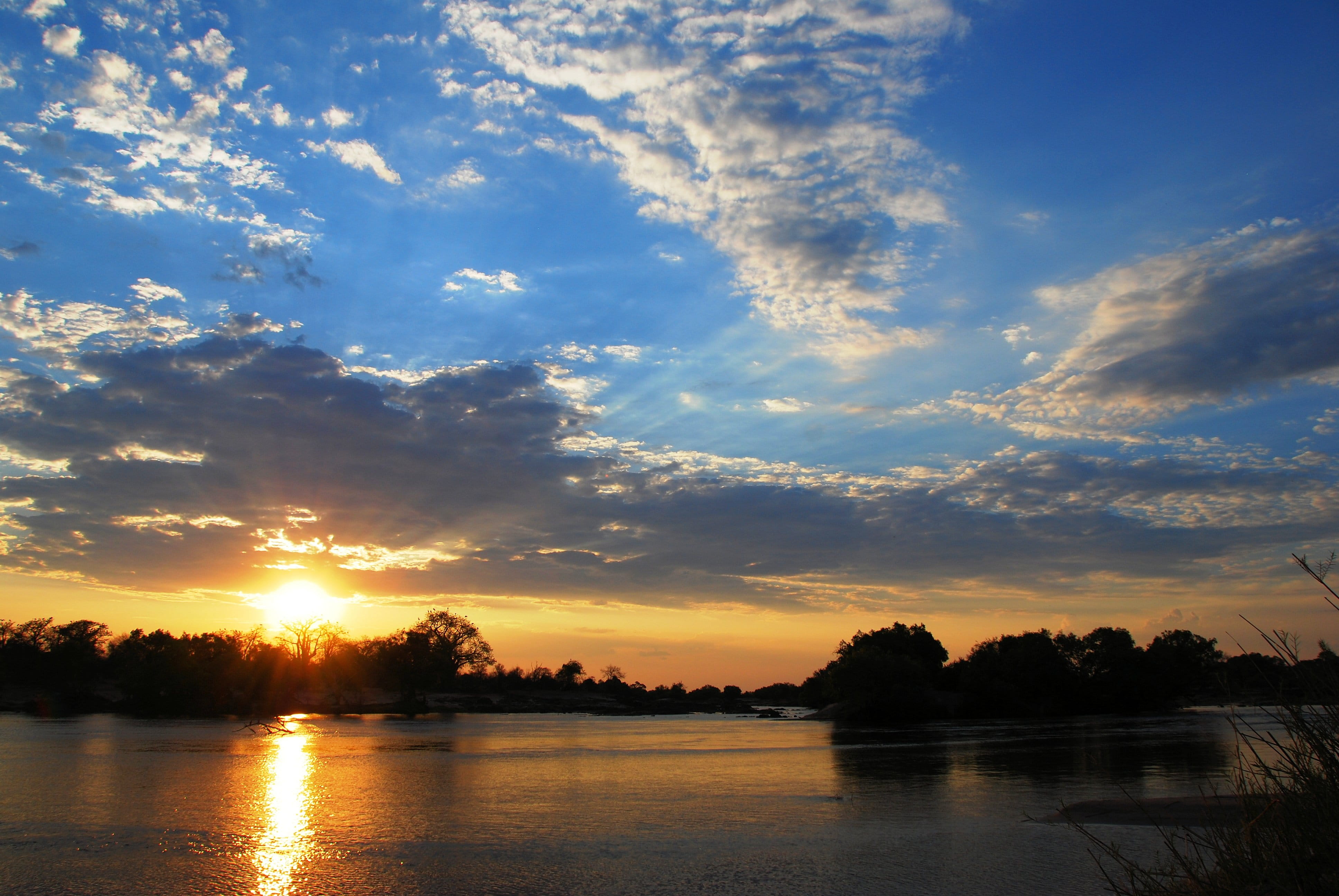 sky, waterfront, sun, tranquil scene, orange color, tree, beauty in nature, 4K, water, cloud - sky, non-urban scene, lake, nature, zambia, outdoors, silhouette, HD Wallpaper