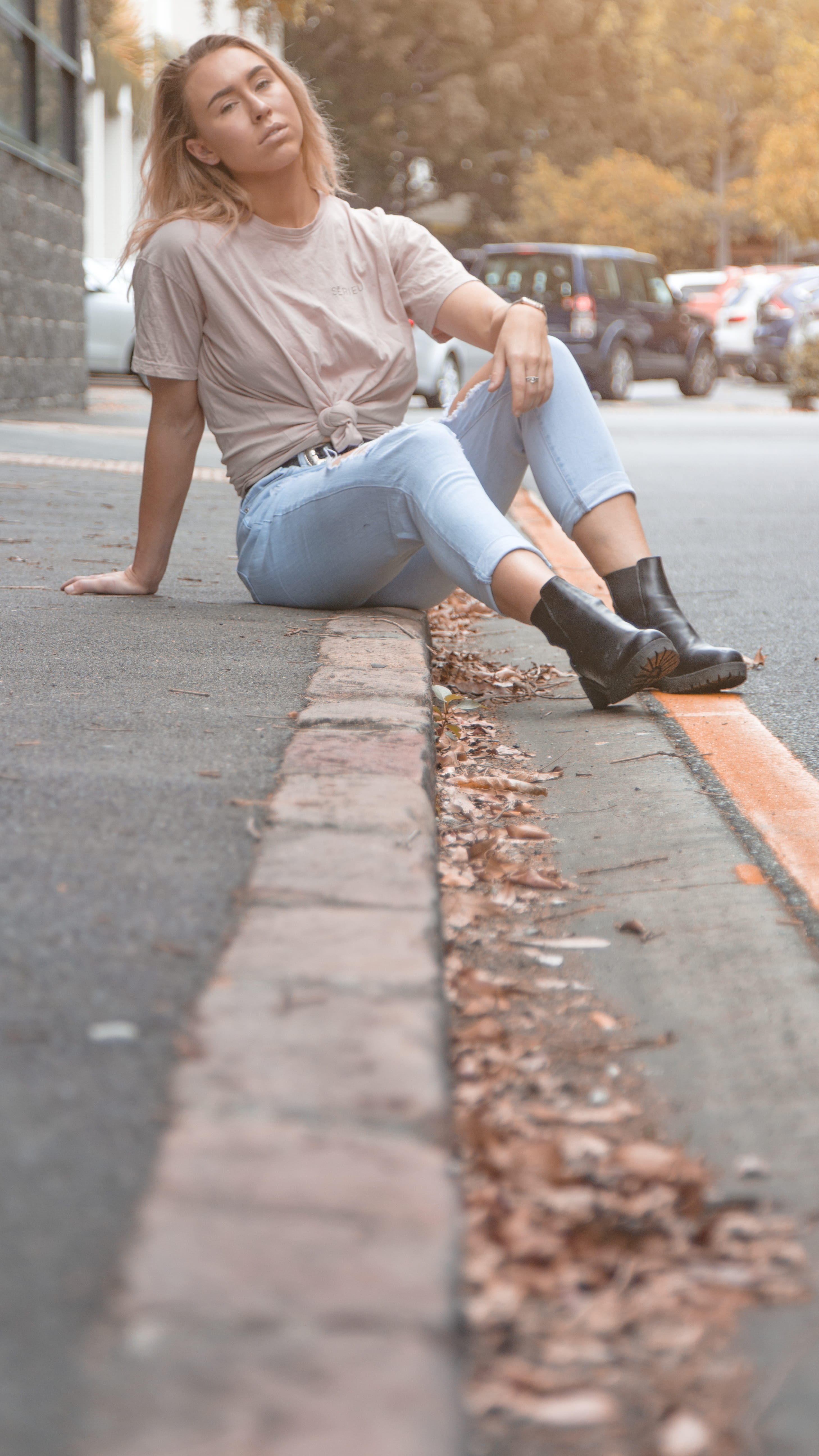 leisure activity, beautiful woman, surface level, full length, hairstyle, lifestyles, 5K, street, young adult, qld, front view, sitting, casual clothing, Phone HD Wallpaper