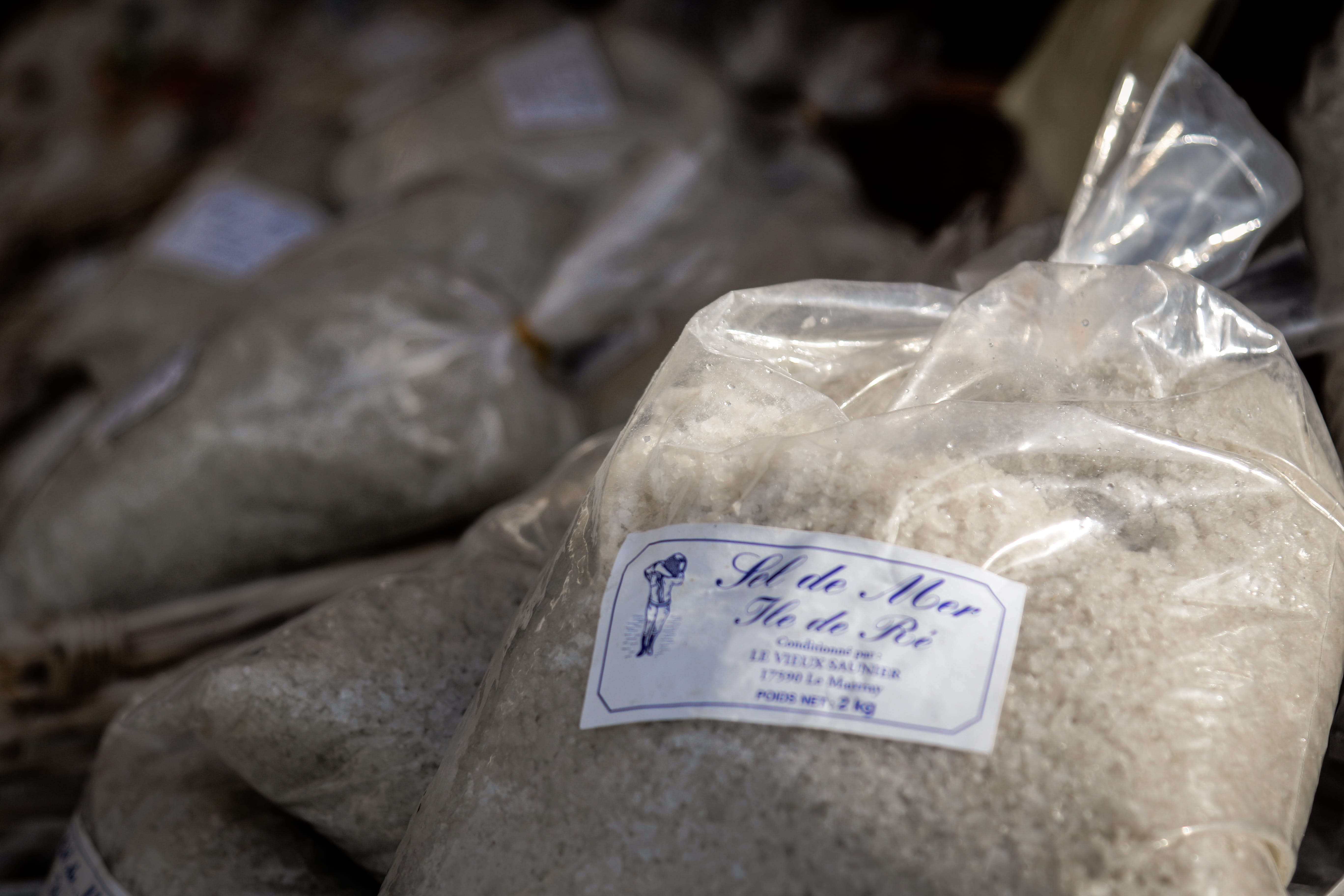bag, close-up, retail, salt, 5K, non-western script, no people, france, indoors, plastic, market, still life, focus on foreground, script, île de ré, number, HD Wallpaper